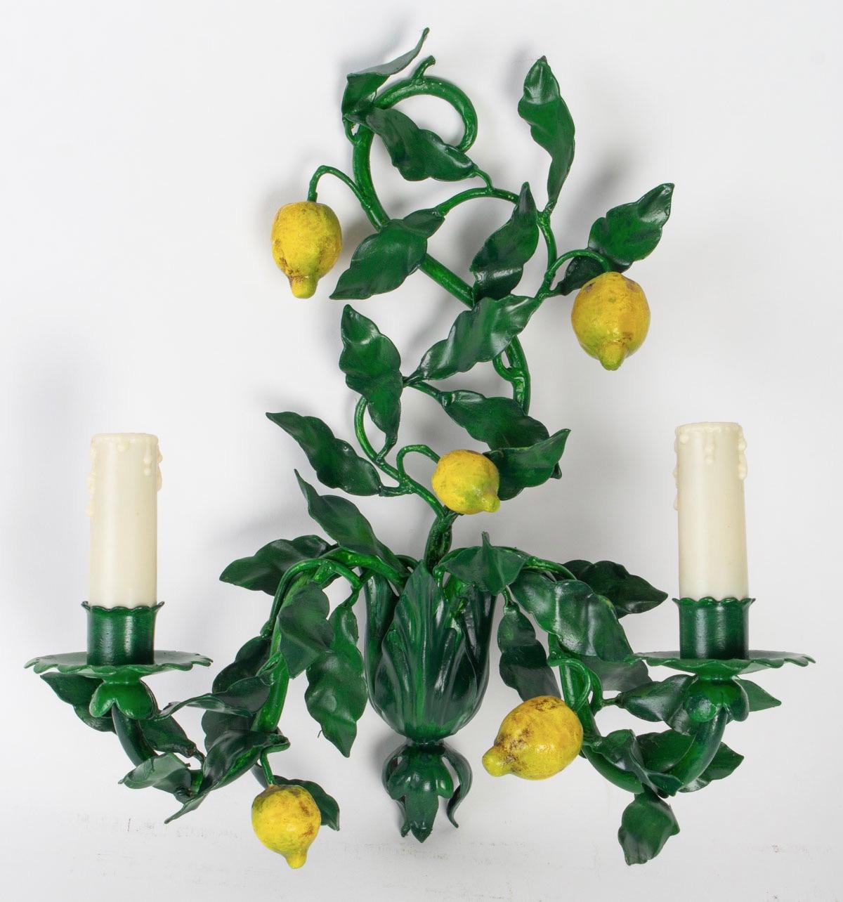 Charming pair of 1960s Maison Honore sconces.
They figure lemon tree branches with leaves and fruit made of painting wrought iron.
Two lighted armes per sconces.