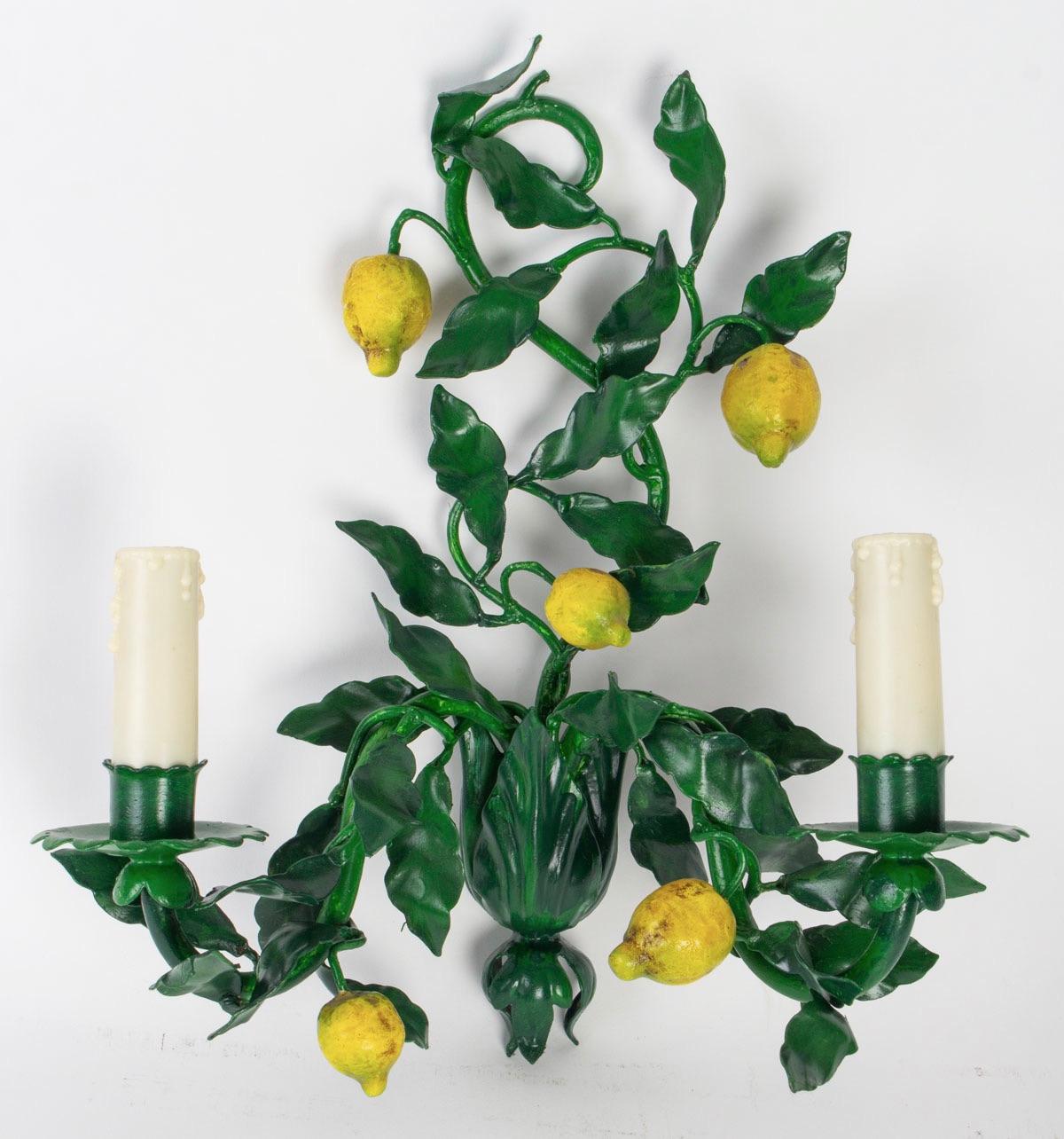 Charming pair of 1960s Maison Honore sconces.
They figure lemon tree branches with leaves and fruit made of painting wrought iron.
Two lighted arms per sconces.