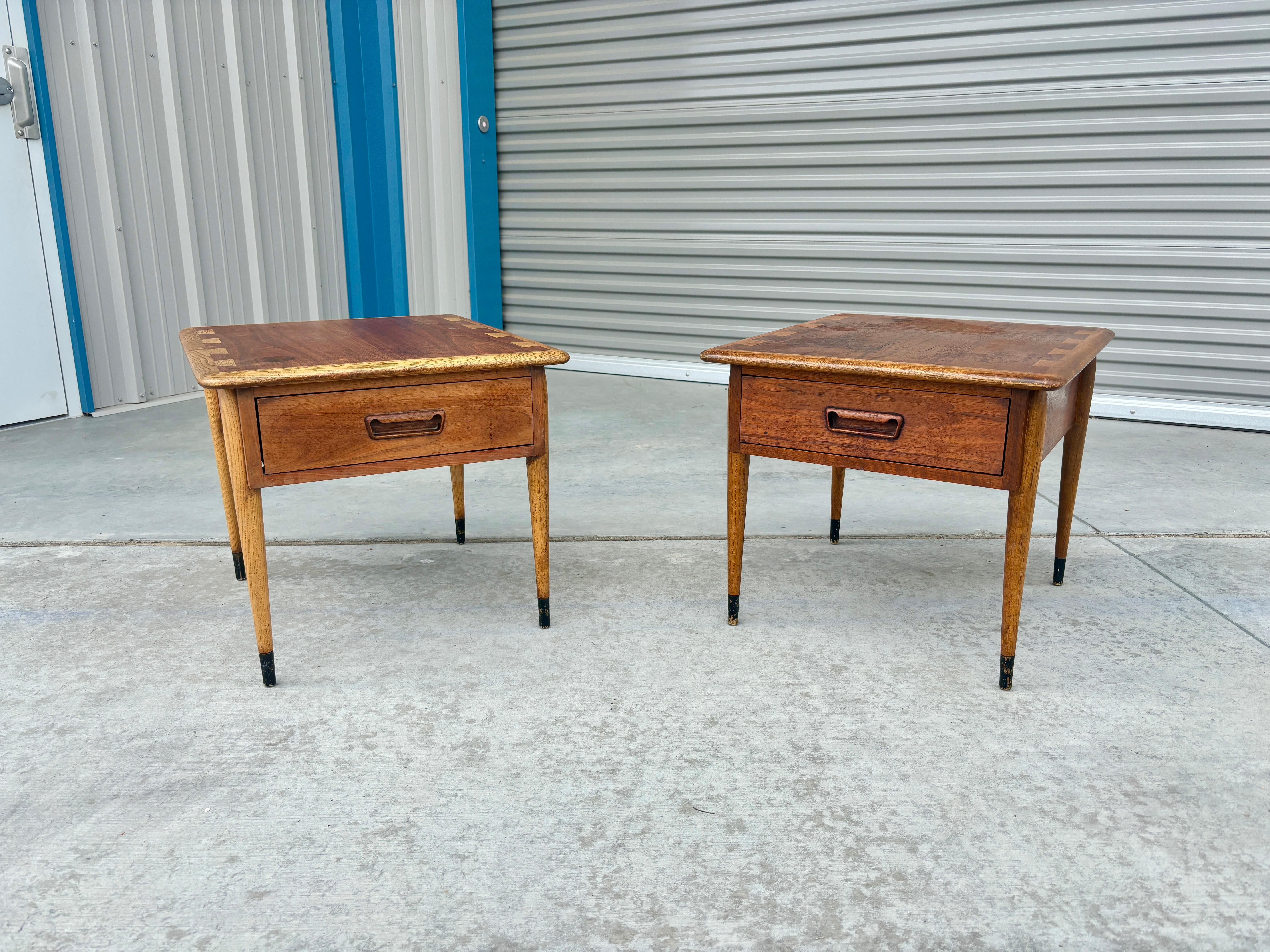 Welcome to Mid-Century NoHo

[Mid Century Pair of End Tables by Lane]

Mid-century walnut side tables designed and manufactured in the United States circa 1960s. These tables have been crafted with a keen eye for detail, featuring a stunning walnut