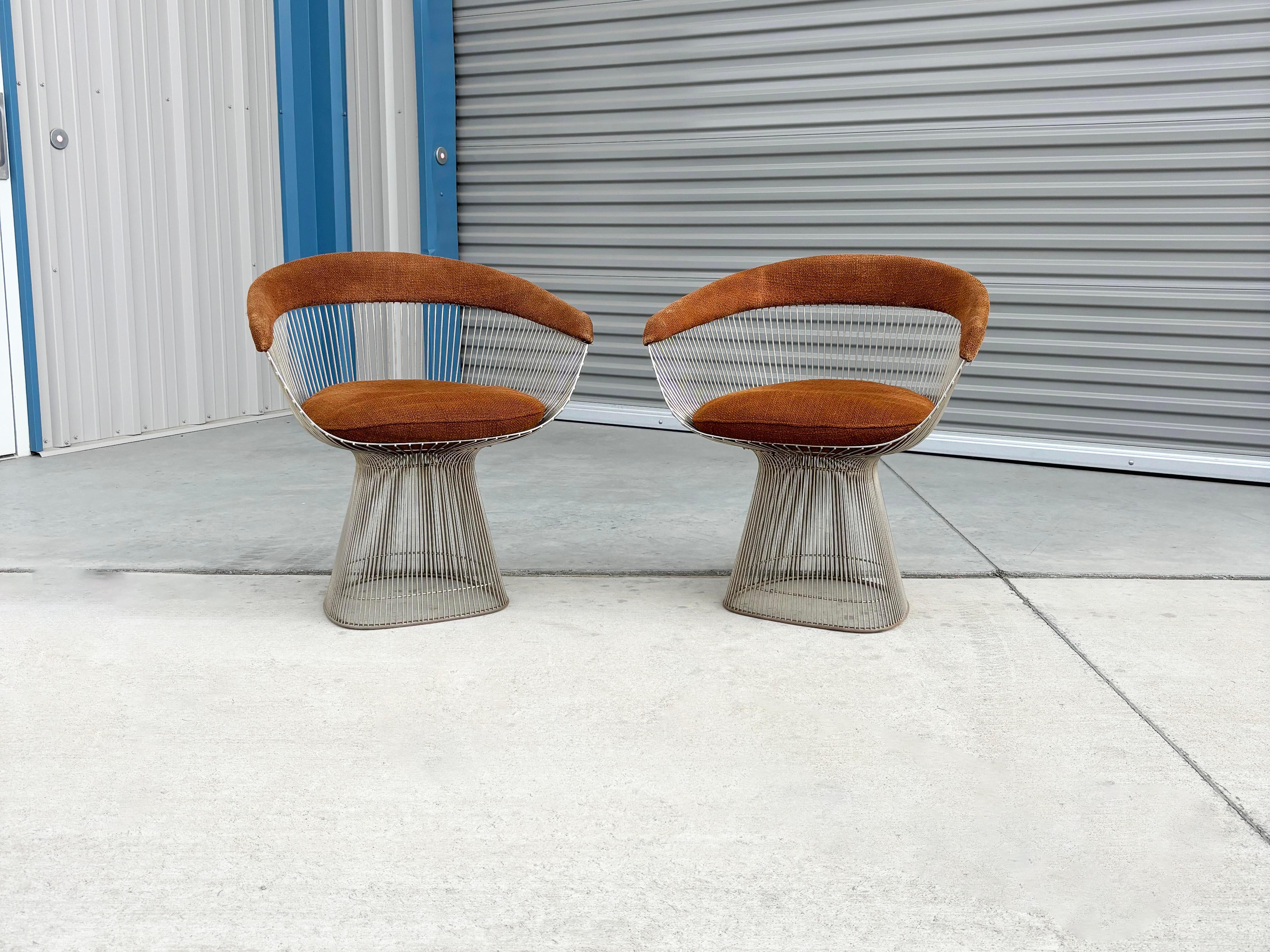Welcome to Mid-Century NoHo

[Pair of Mid Century Warren Platner Dining Chairs for Knoll]

This sophisticated set of mid-century dining chairs, crafted by Warren Platner for Knoll, features gracefully curved, nickel-plated metal rods that are