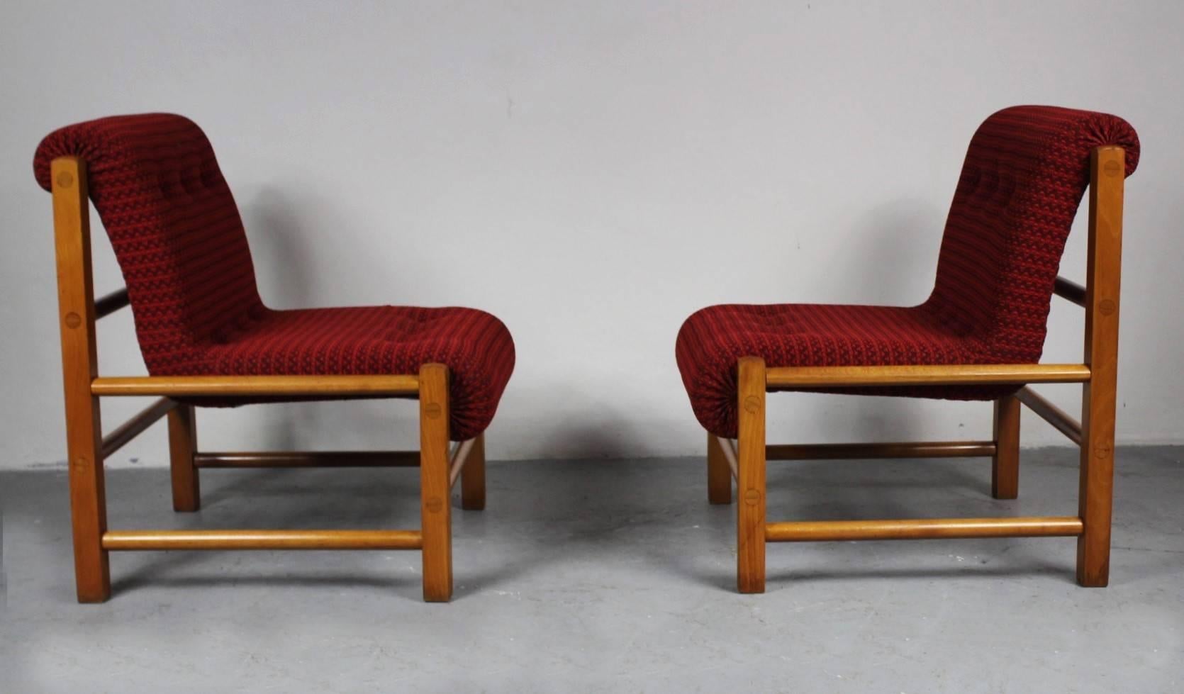 Pair of easy chairs made in the Czech republic in the 1960s. Upholstered with thick red fabric. The chairs are in very good original condition.