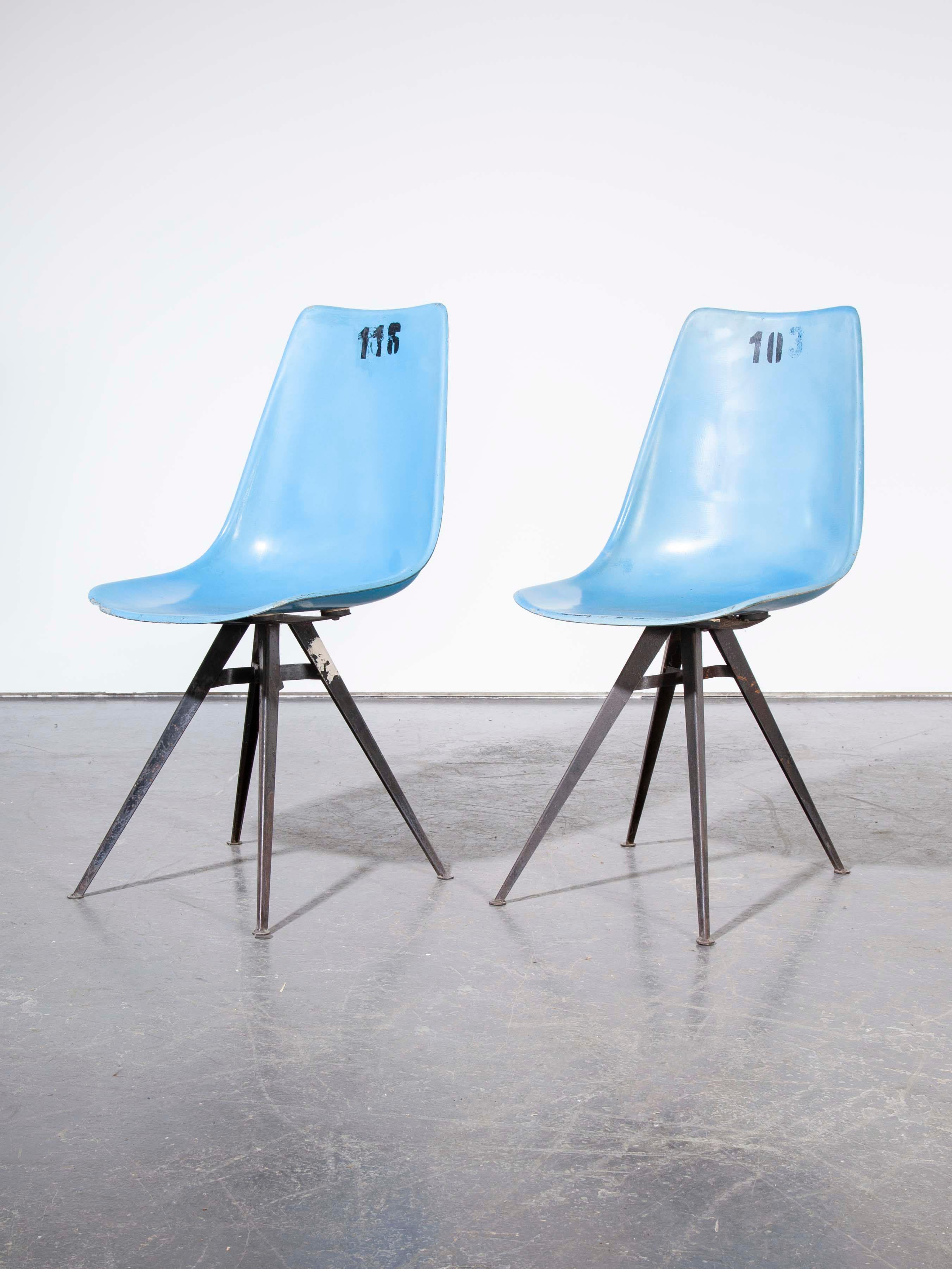 1960s pair of original blue fiberglass side / dining chairs.

1960s vintage pair of original blue fiberglass side / dining chairs. Sourced from a sports stadium outside Prague these numbered chairs have a great shape and a fabulous angular base.