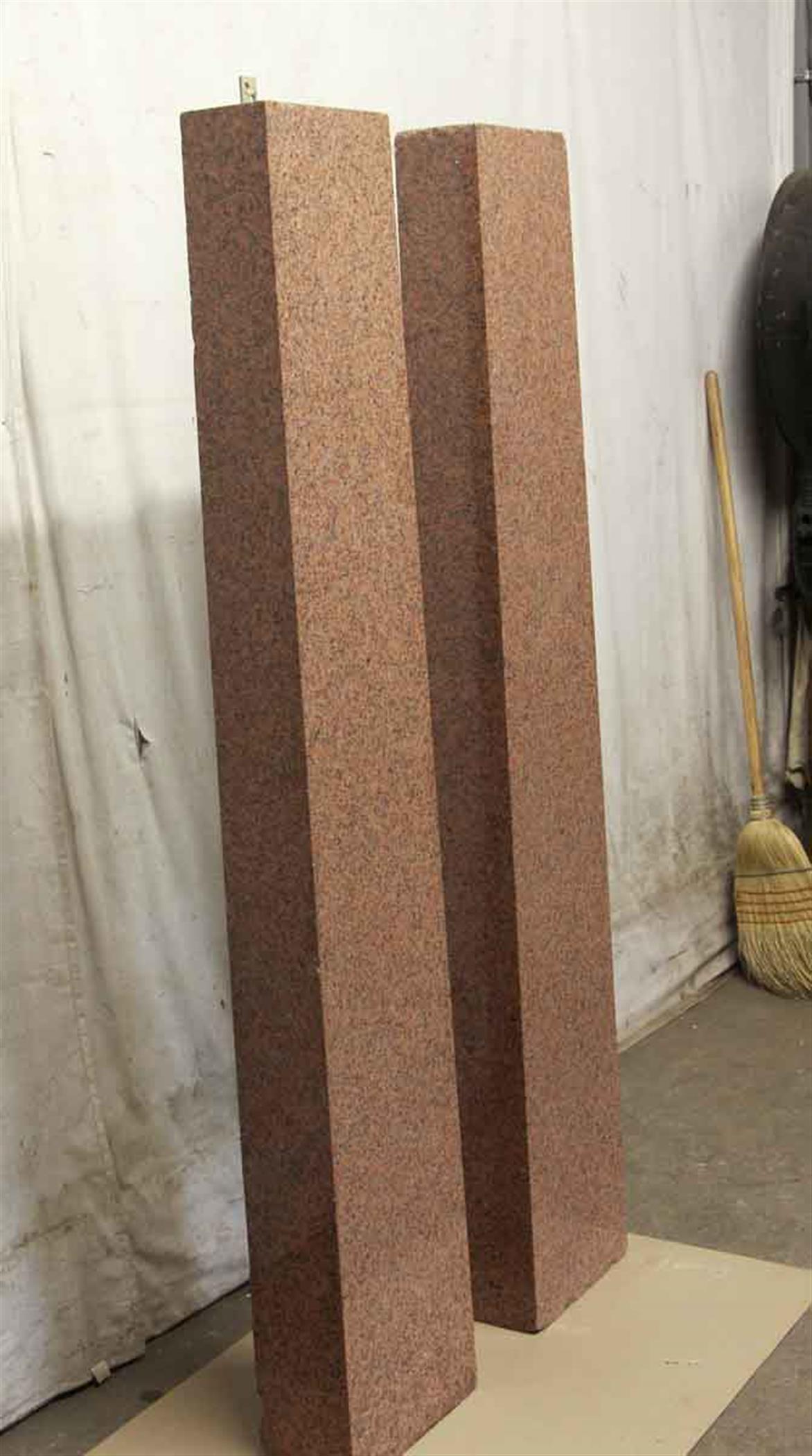 Tall 1960s solid granite columns in a textured brown color. Priced as a pair. This can be seen at our 400 Gilligan St location in Scranton, PA.