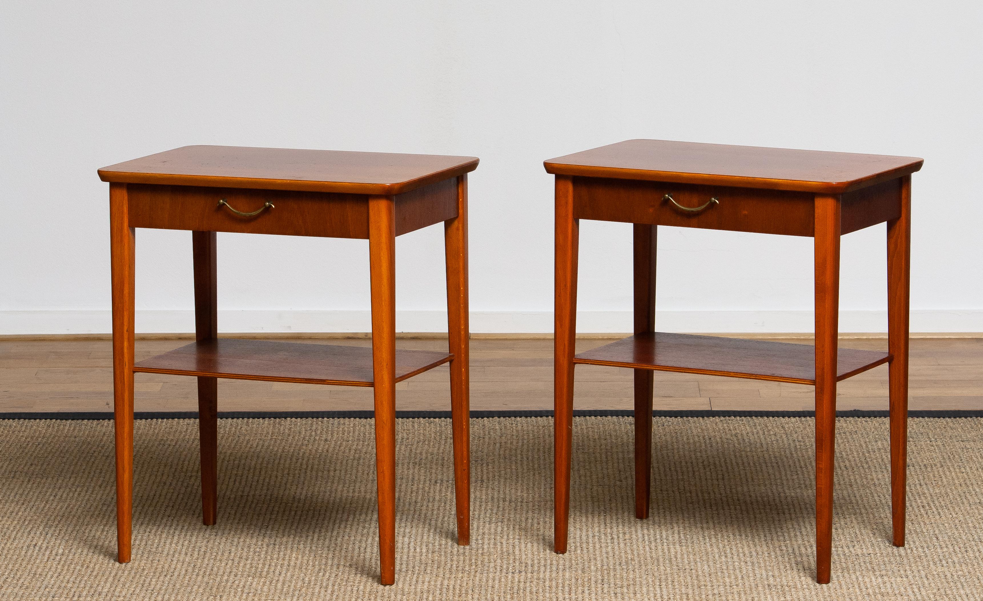 Beautiful and elegant set of two brass and mahogany nightstands made in Sweden, 1960s.
The set is matching pair and in good condition.
