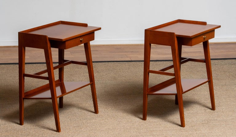Exclusive set of two great designed and well made Swedish solid mahogany nightstands / bedside tables from the '60s.
Consists beside the great design a drawer and a bookshelf each. Overall in good condition.
   