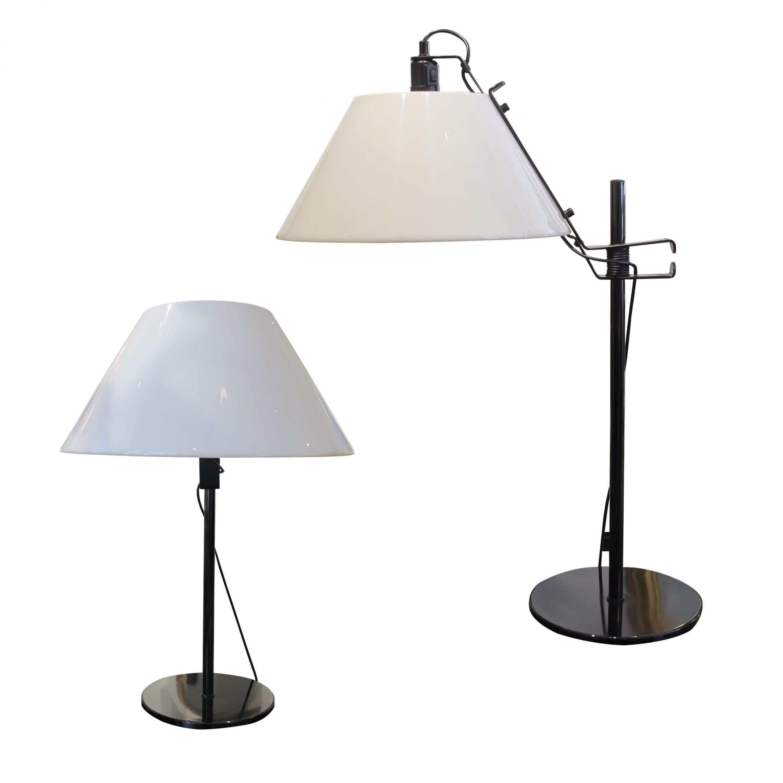 A large pair of table lamps by Metalarte with white adjustable conical Lucite shades. The shades are mounted on large spring clips to adjust their height as desired. Made in Spain in the 1960s. The lamps are finished with a black galvanised base and