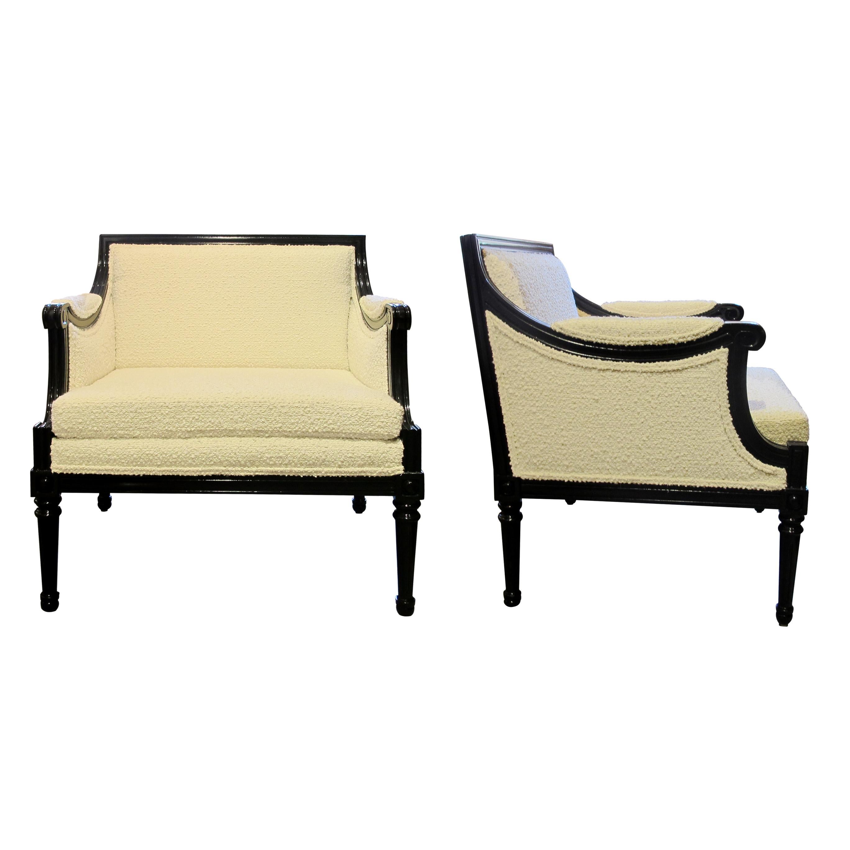 These comfortable tub square armchairs are a classic Swedish design from the 1960s. They have been reupholstered in a light cream bouclé fabric and the walnut frames have been lacquered to a black semi-gloss finish which gives them a fresh and