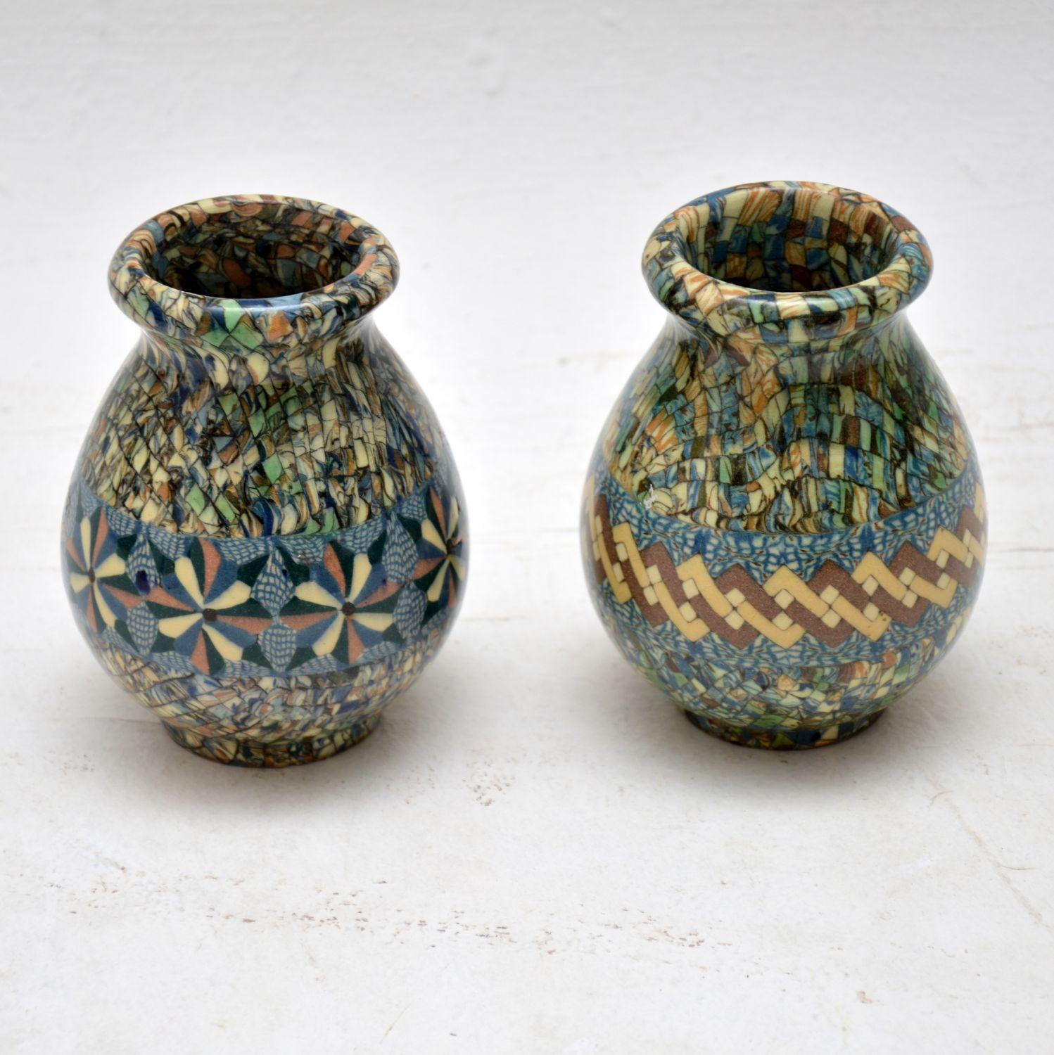 A beautiful pair of ceramic ‘Mosaic’ vases, these were designed by Jean Gerbino and were made by Vallauris in France in the 1960s. They are signed on the undersides, and they are in superb condition, with no wear or damage to be seen.

Measures: