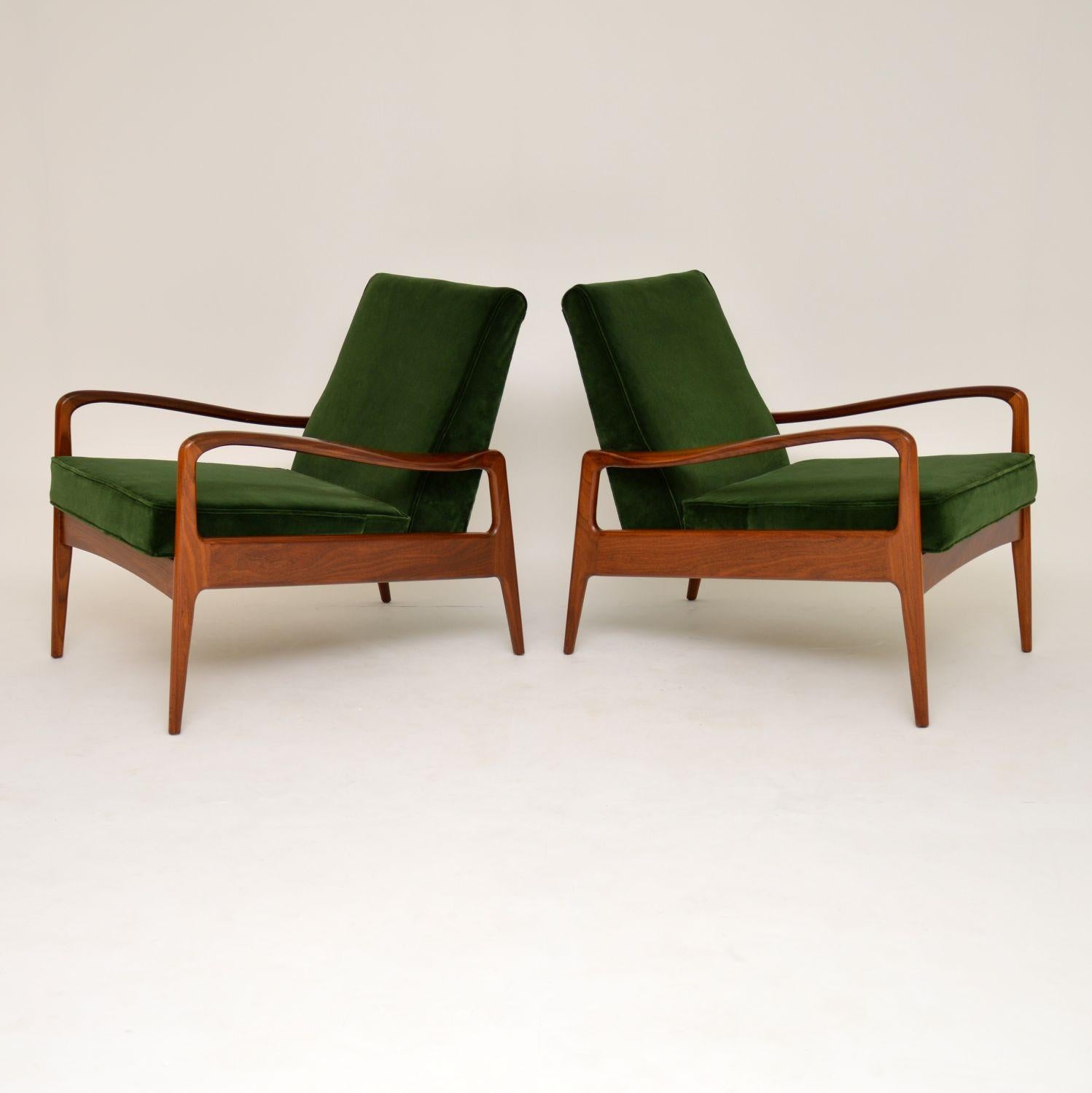 A stunning pair of vintage armchairs, these were made by Greaves & Thomas in the 1960s, they are of super quality and design. We have had these fully restored to a very high standard, the condition is superb throughout. The solid afromosia frames