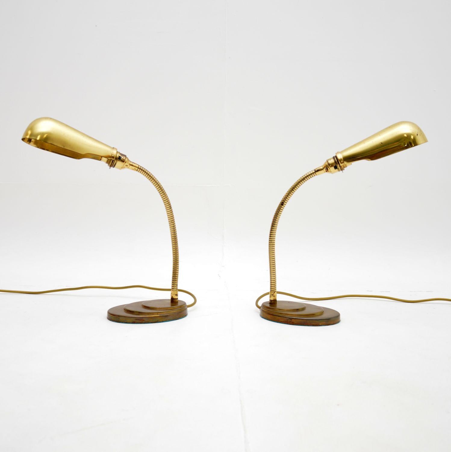 A wonderful pair of vintage brass goose neck table lamps. They were made in England, they date from the 1960-70’s.

The quality is fantastic, they are a lovely size and have a very useful design. The necks are adjustable, the shades also