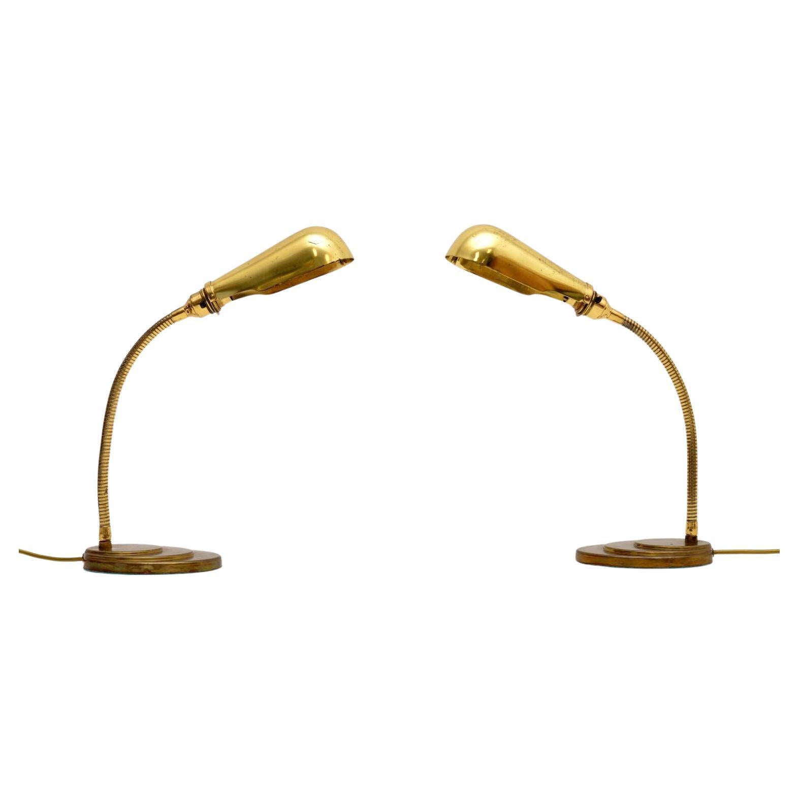 A wonderful pair of vintage brass goose neck table lamps. They were made in England, they date from the 1960-70’s.

The quality is fantastic, they are a lovely size and have a very useful design. The necks are adjustable, the shades also