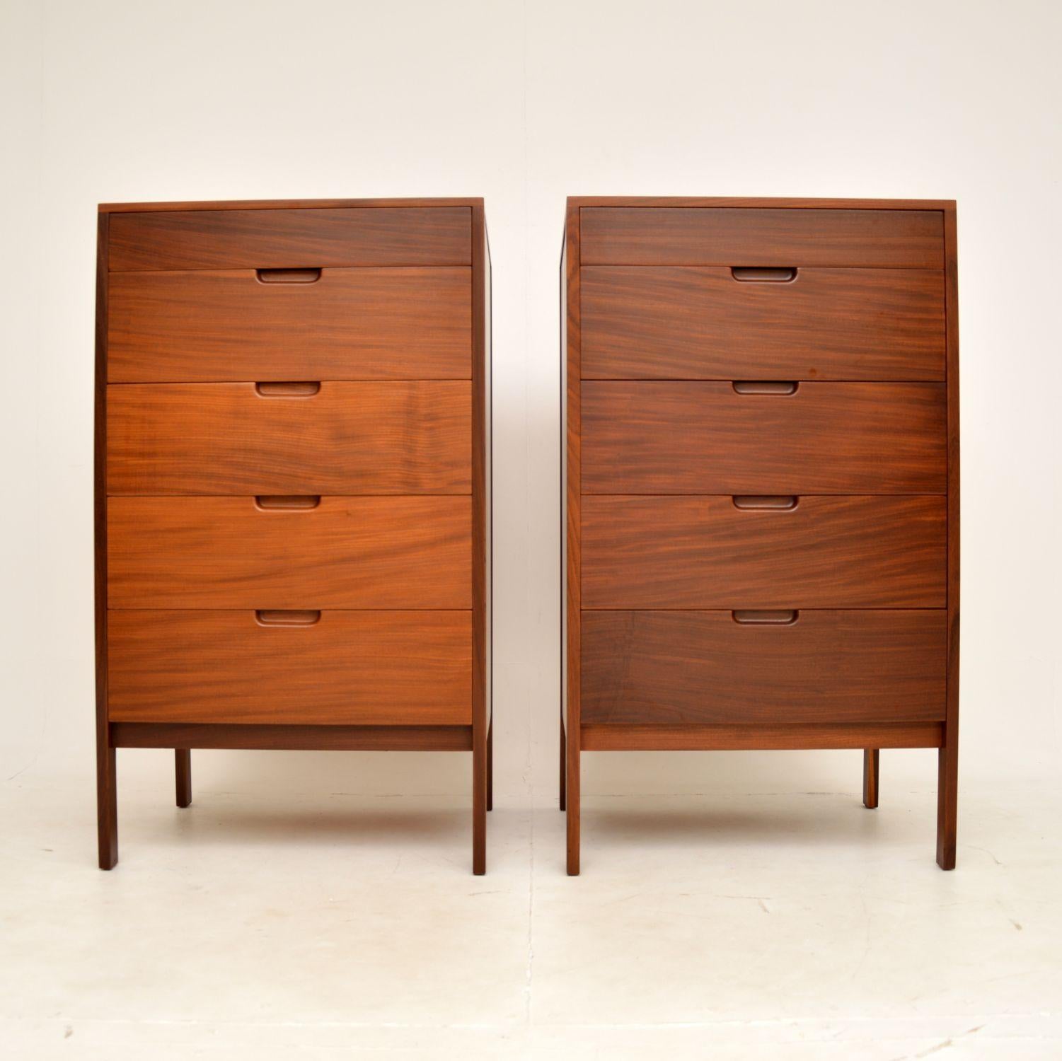 A stylish and extremely rare pair of vintage tallboy chest of drawers. They were made in England, and were designed by Richard Hornby for Heals as part of the Fyne Ladye range.

The quality is exceptional and they are beautifully designed, with a