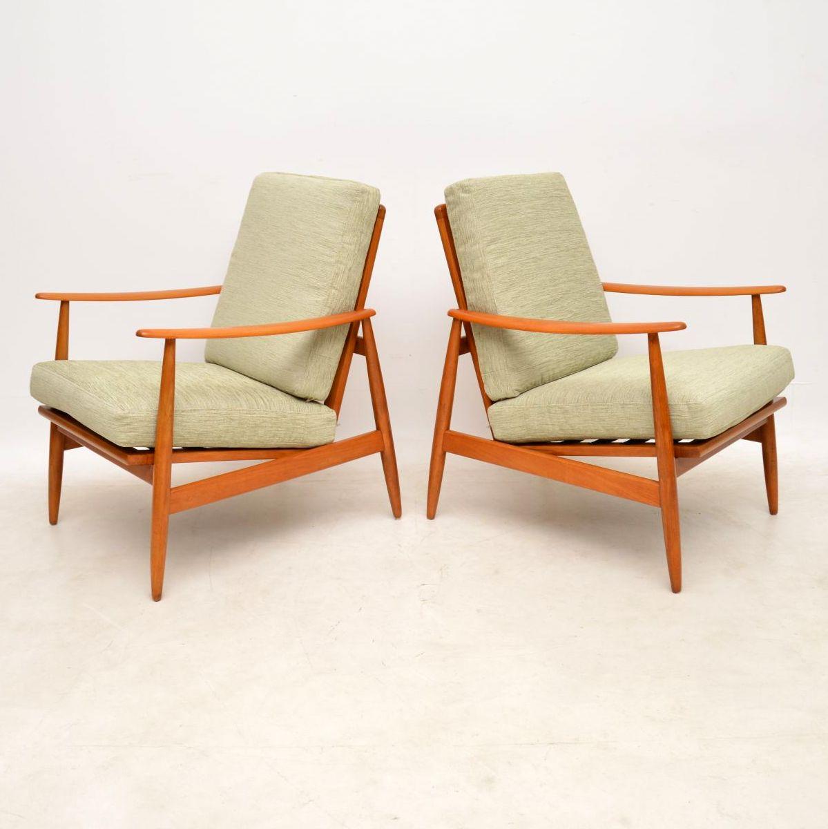 A stylish, elegant and extremely well made pair of Danish vintage armchairs, these date from the 1960s. We have had the frames completely stripped and re-polished to a very high standard, the condition is amazing and they have a lovely, warm color.