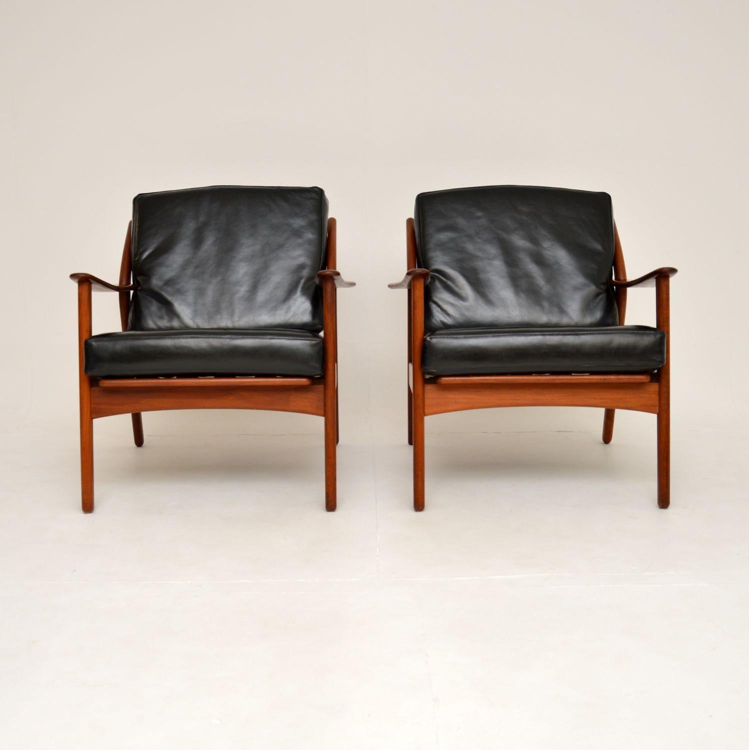 A stylish and extremely rare 1960’s pair of vintage Danish armchairs by Niels Koefoed in solid teak and leather.

The quality is superb, they have a beautiful and curvaceous design, with solid teak construction throughout.

The condition is