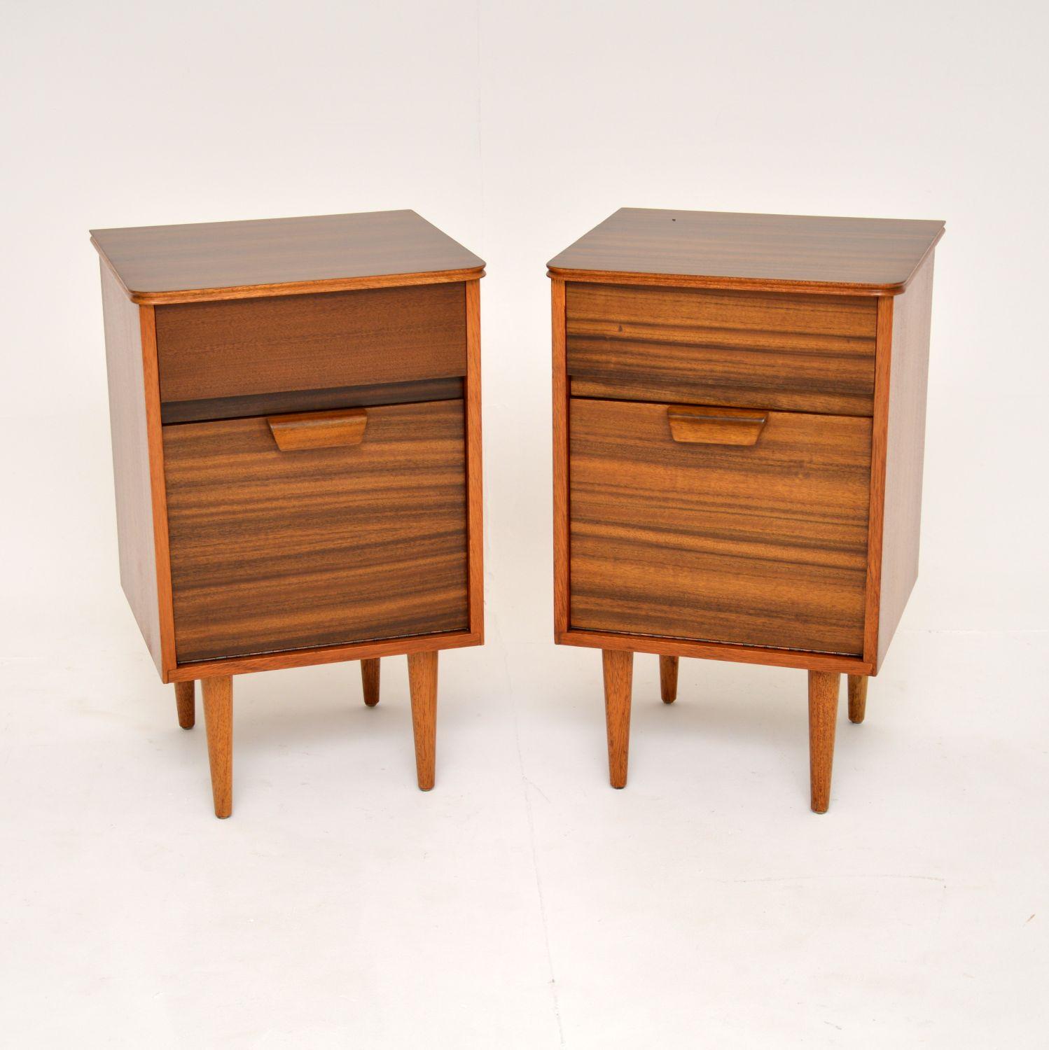 A smart and stylish pair of vintage walnut bedside cabinets. These were made in England by Uniflex and were designed by Gunther Hoffstead. They date from the 1960’s.

The quality is superb, these are beautifully designed and are a very useful