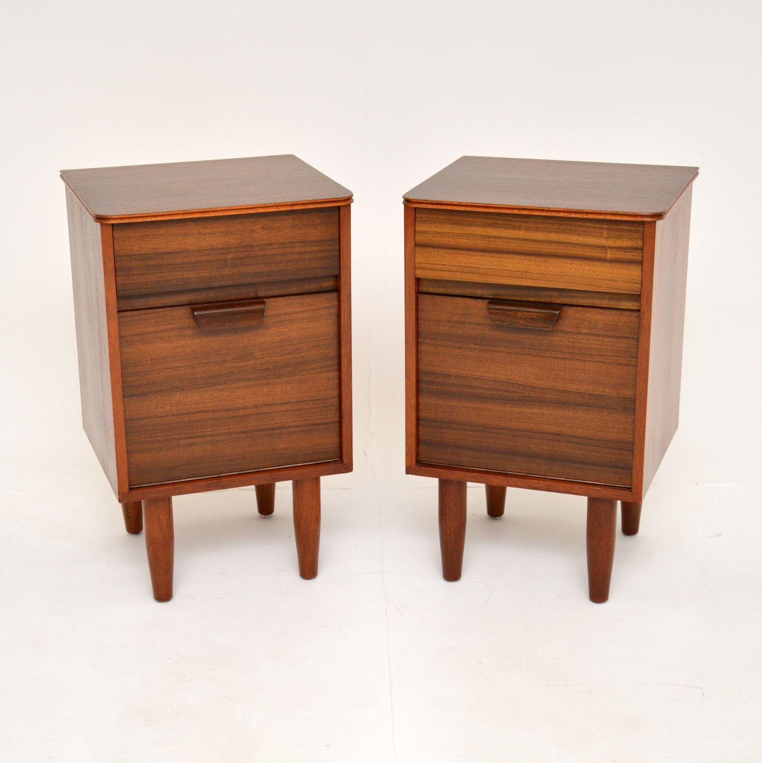 A smart and stylish pair of vintage walnut bedside cabinets. These were made in England by Uniflex and were designed by Gunther Hoffstead. They date from the 1960’s.

The quality is superb, these are beautifully designed and are a very useful