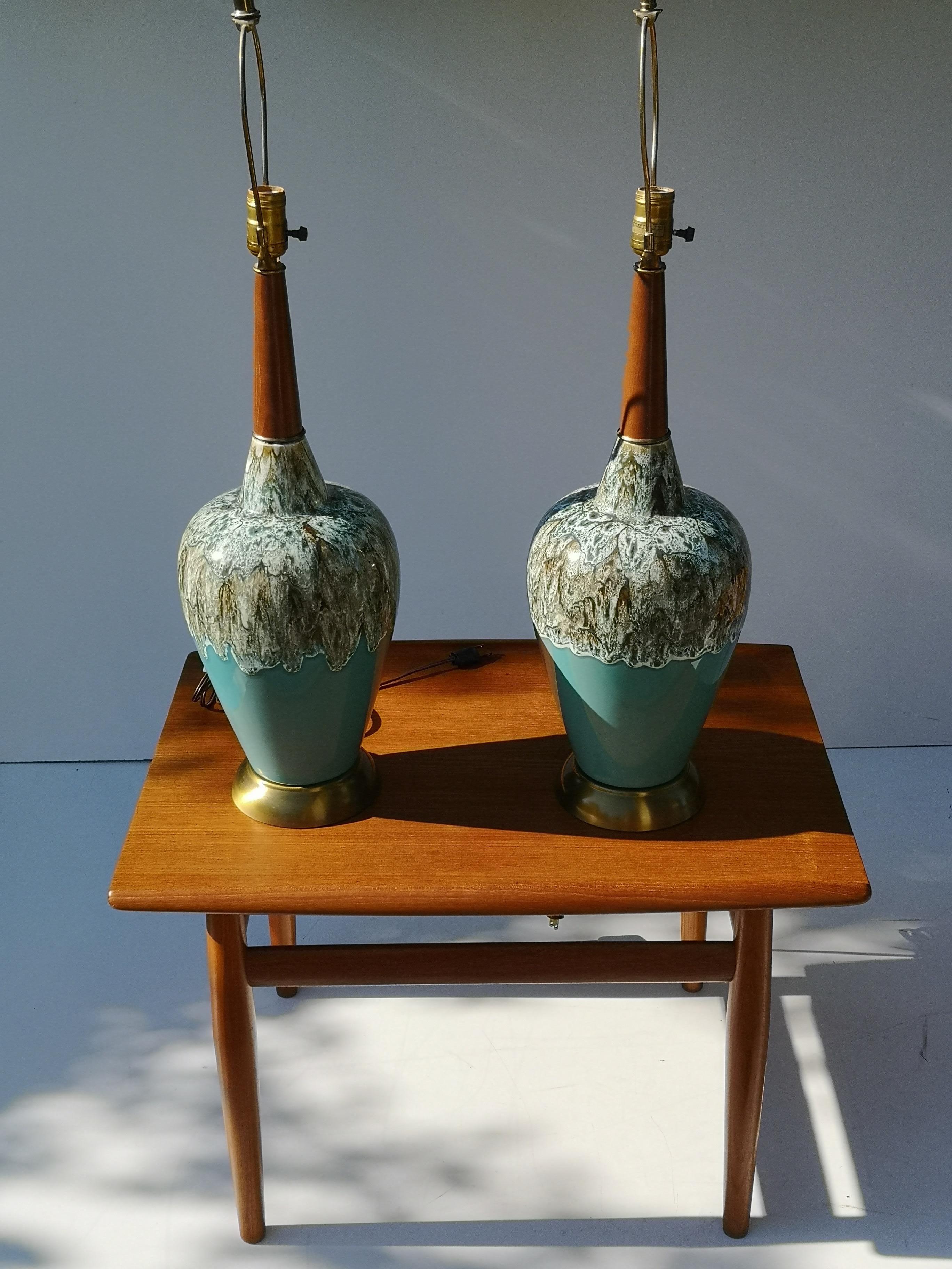 Unique pair of 1960s ceramic drip glazed lamps on brushed metal base, with solid walnut necks. Exceptional condition - includes original shades. 

Measures: Shade diameter 16.25