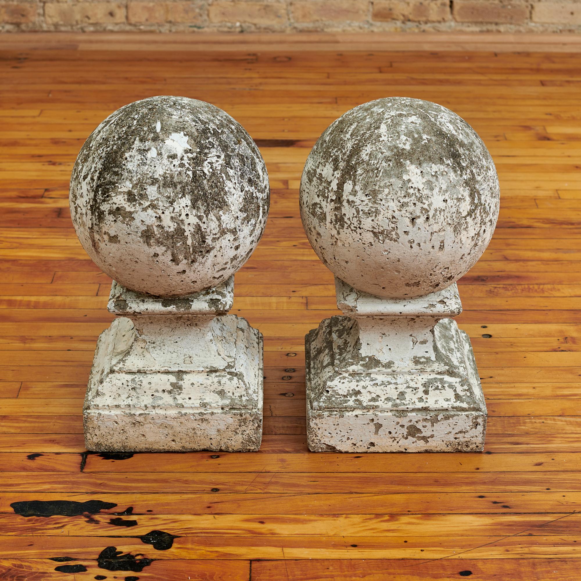 Pair of painted concrete finials from France, circa 1960s. These exhibit great character and patina from years of elements exposure. A beautifully classic accent whether used indoors or outside. 

Dimensions: 10
