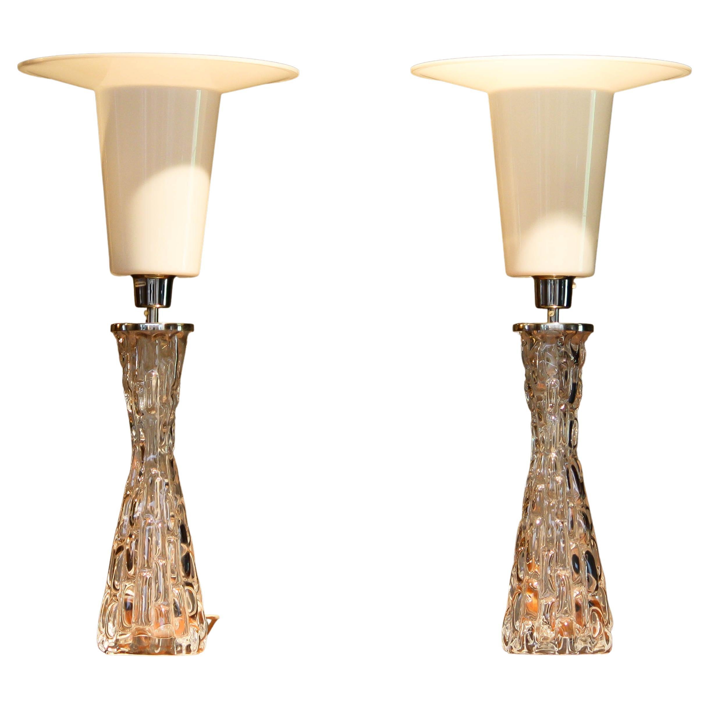 Beautiful set of two clear crystal and chromed table lamps designed by Carl Fagerlund for Orrefors Crystal in Sweden.
consists one screw fitting size E27 / 28 110 and 230 volts with a maximum of 100Watts each.
Electronic parts as well as the
