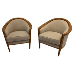 1960s pair Swedish teak curved armchairs reupholstered in a neutral linen