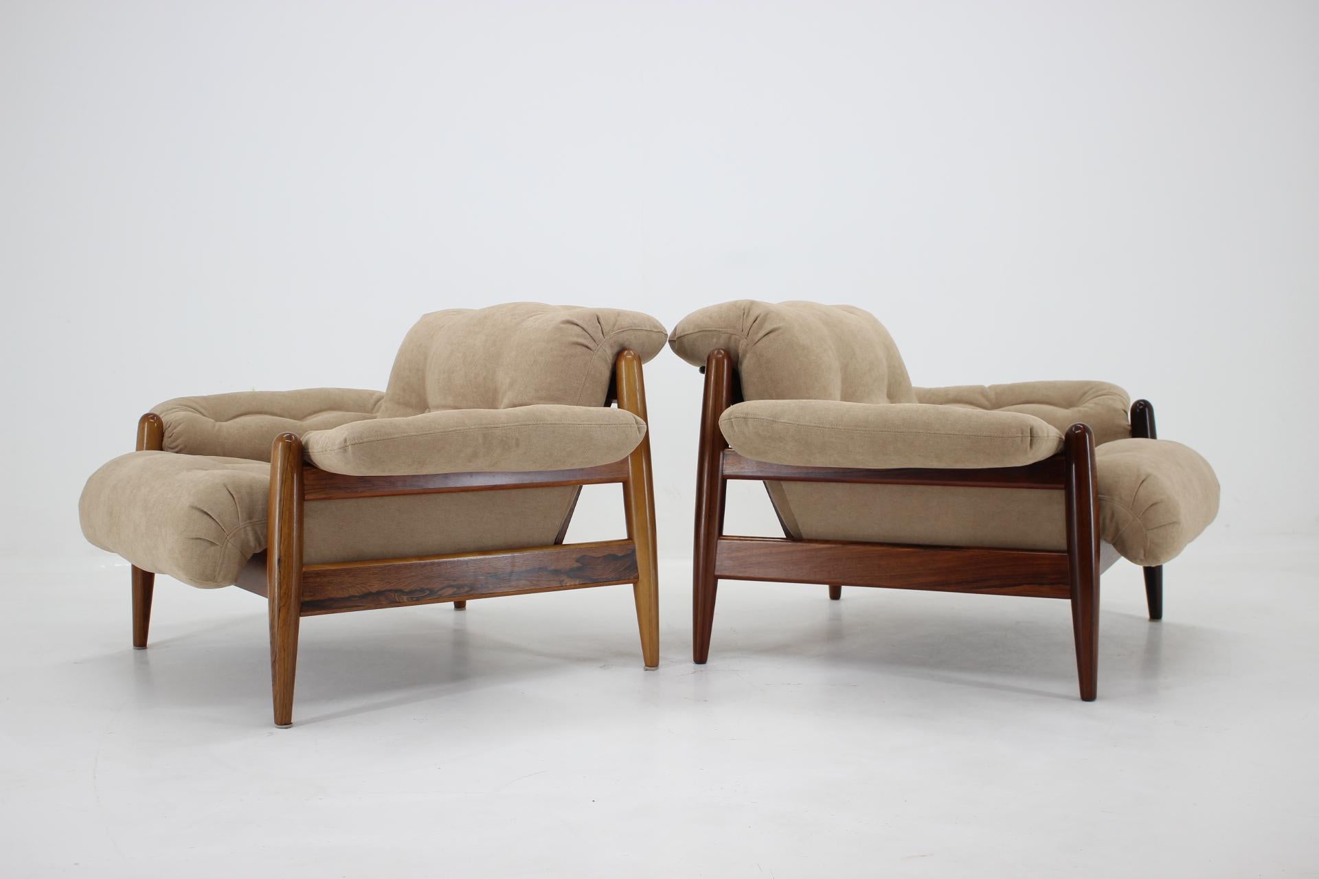 Newly upholstered. The frame is made of massive and veneered palisander. In style of Sergio Rodriguez.