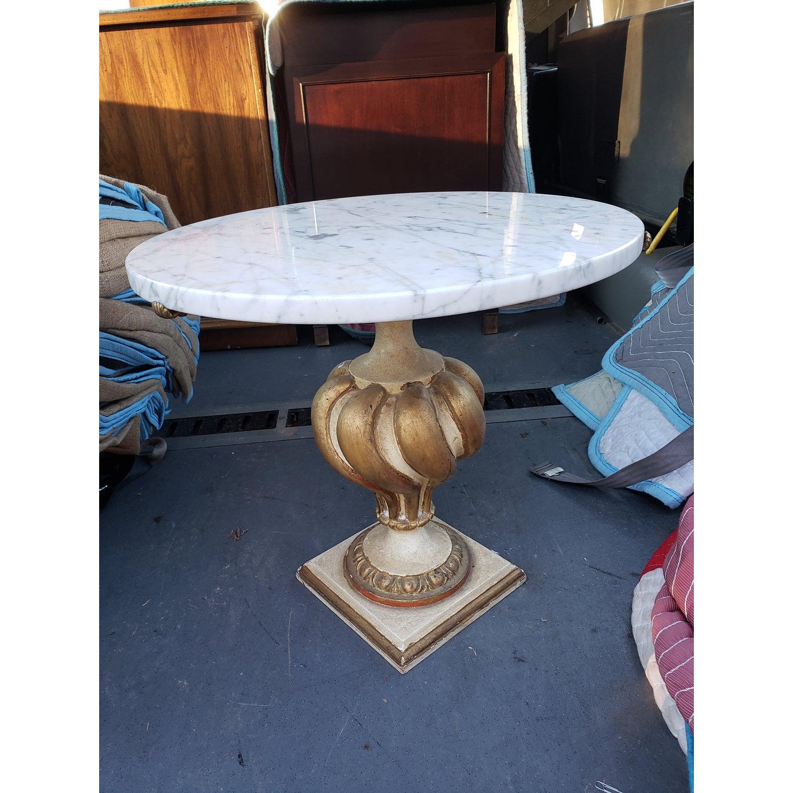 Mid Century marble accent table, having a round top of aged marble on a cerused ornate Cast Plaster pedestal base shaped as a trophy. Detachable marble top.
 Rare item.
Made in Italy in the 1960s.