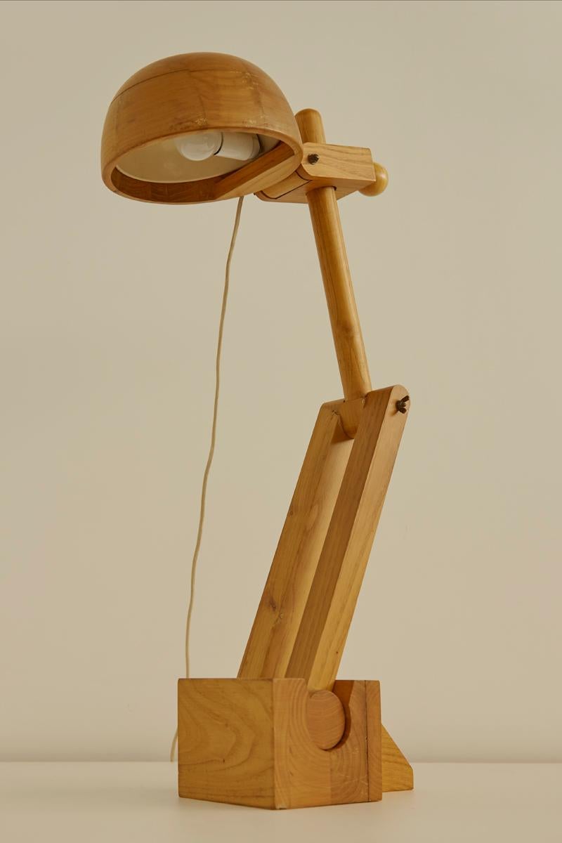 Exceptional solid wooden desk lamp by Paolo Pallucco for Pallucco Roma. This striking piece features exaggerated proportions and has adjustable joints making it practical, elegant and versatile. 


