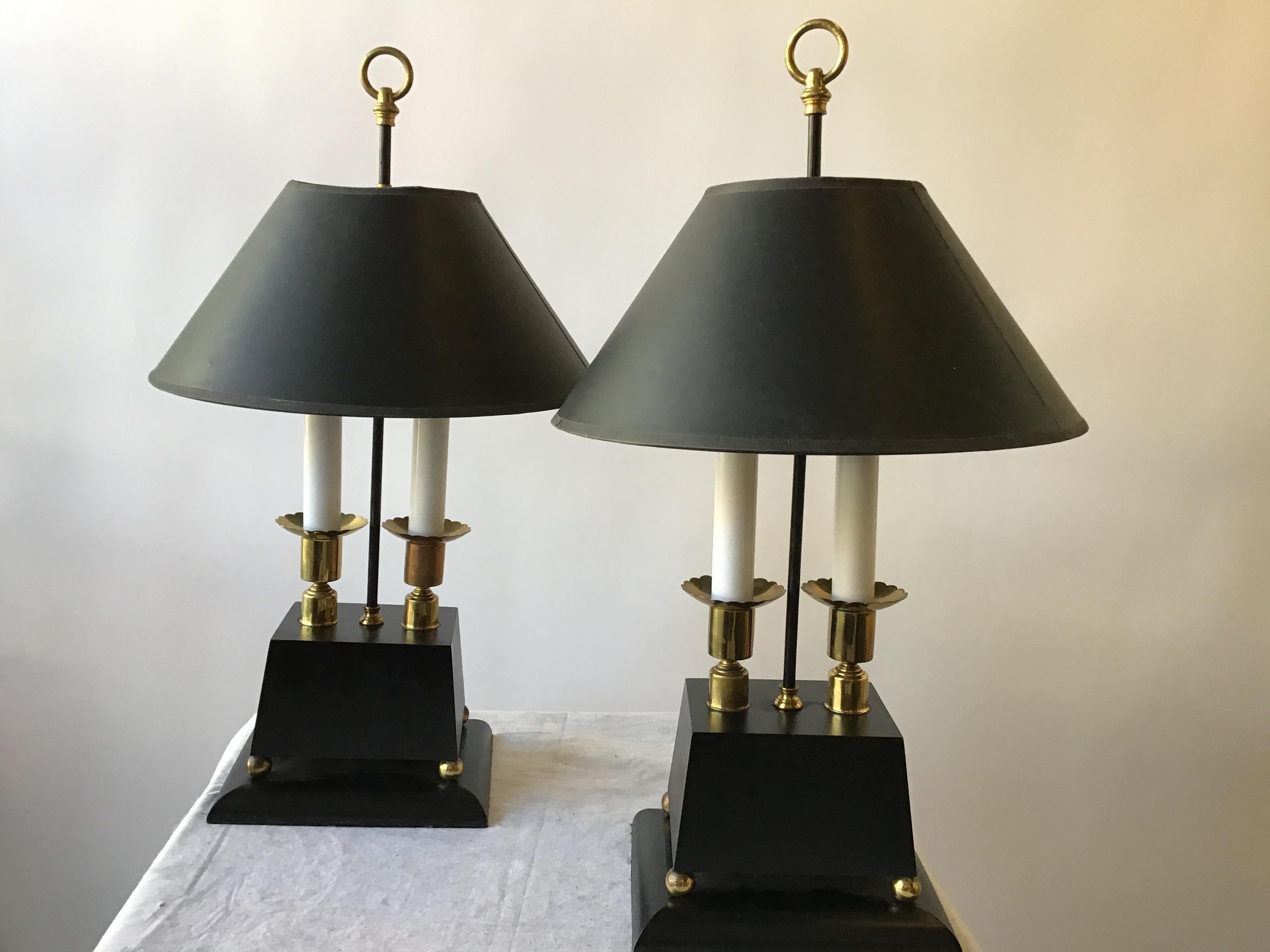 1960s Parzinger style brass lamps on wood bases.