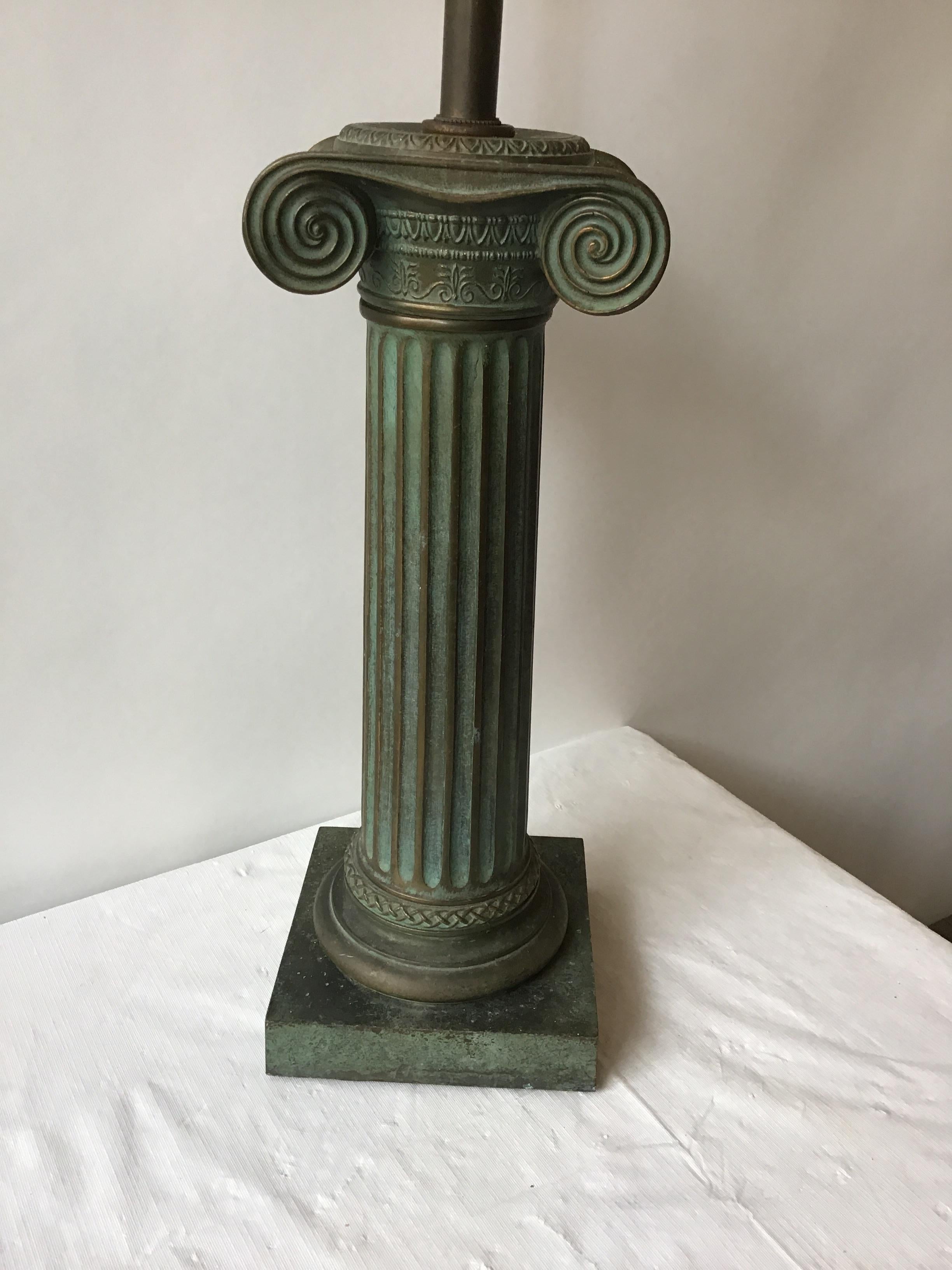 1960s patinated brass ionic column lamp.