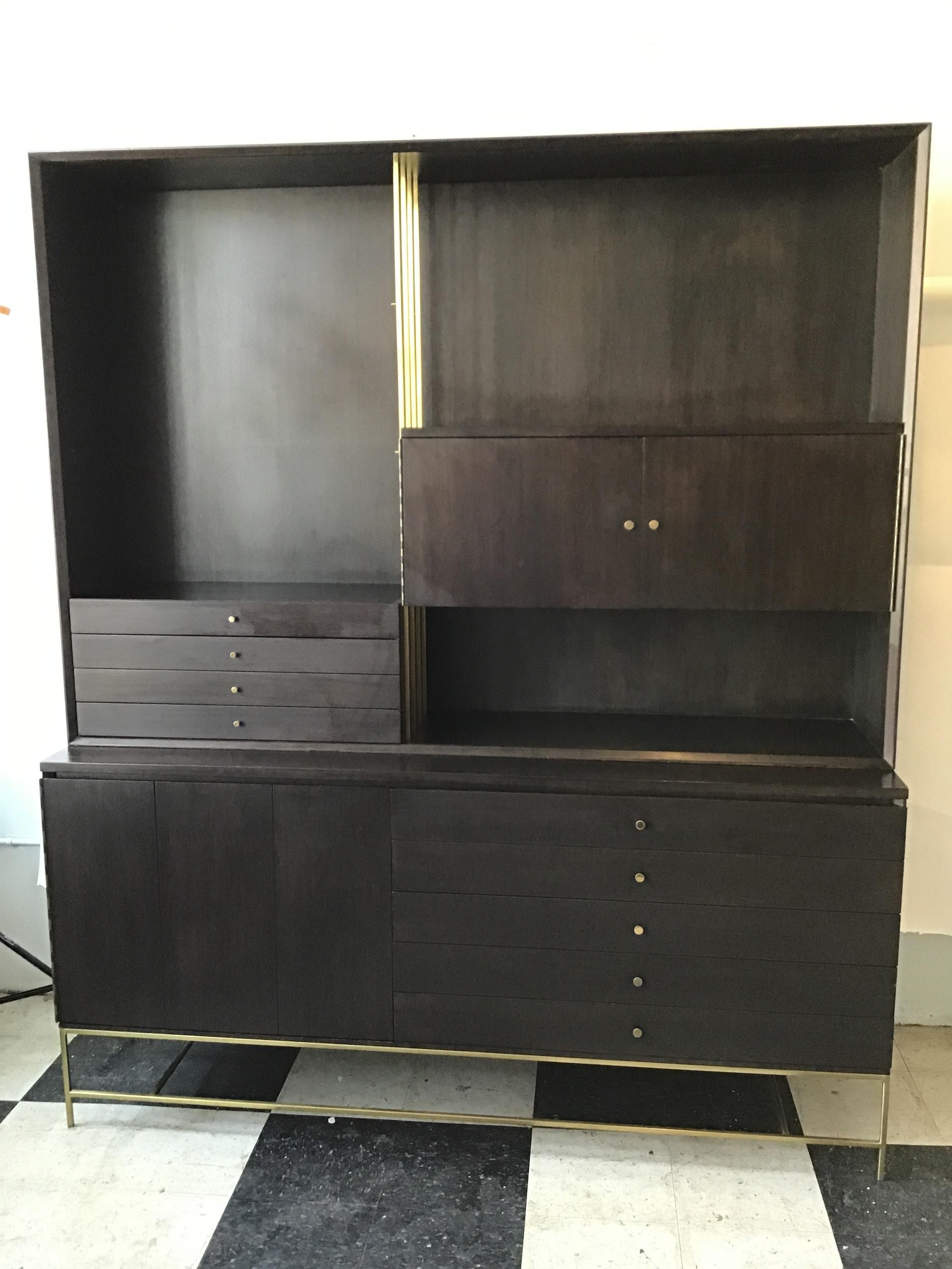 1960s Paul McCobb for Calvin wall unit. Purchased from a NYC estate. The piece was refinished 8 years ago. Comes with two glass shelves, not pictured.