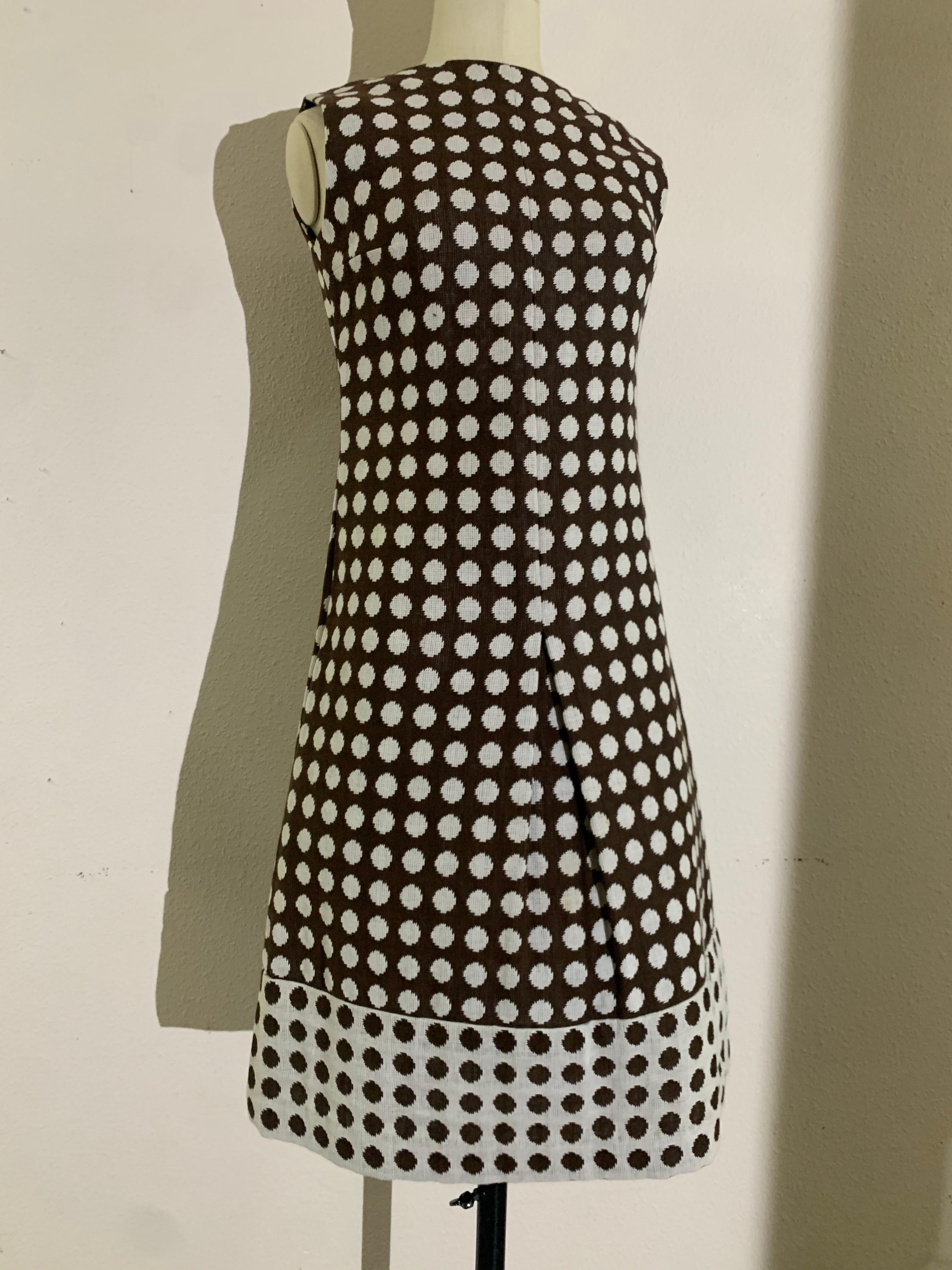 1960s Pauline Trigere Mod Brown & White Wove Cotton Polka Dot Midi Dress: An iconic Pop-Art styled summer day dress with Lichtenstein-inspired polka dot and a reversed motif hemline. Center front skirt pleat. Neckline is high and straight across.