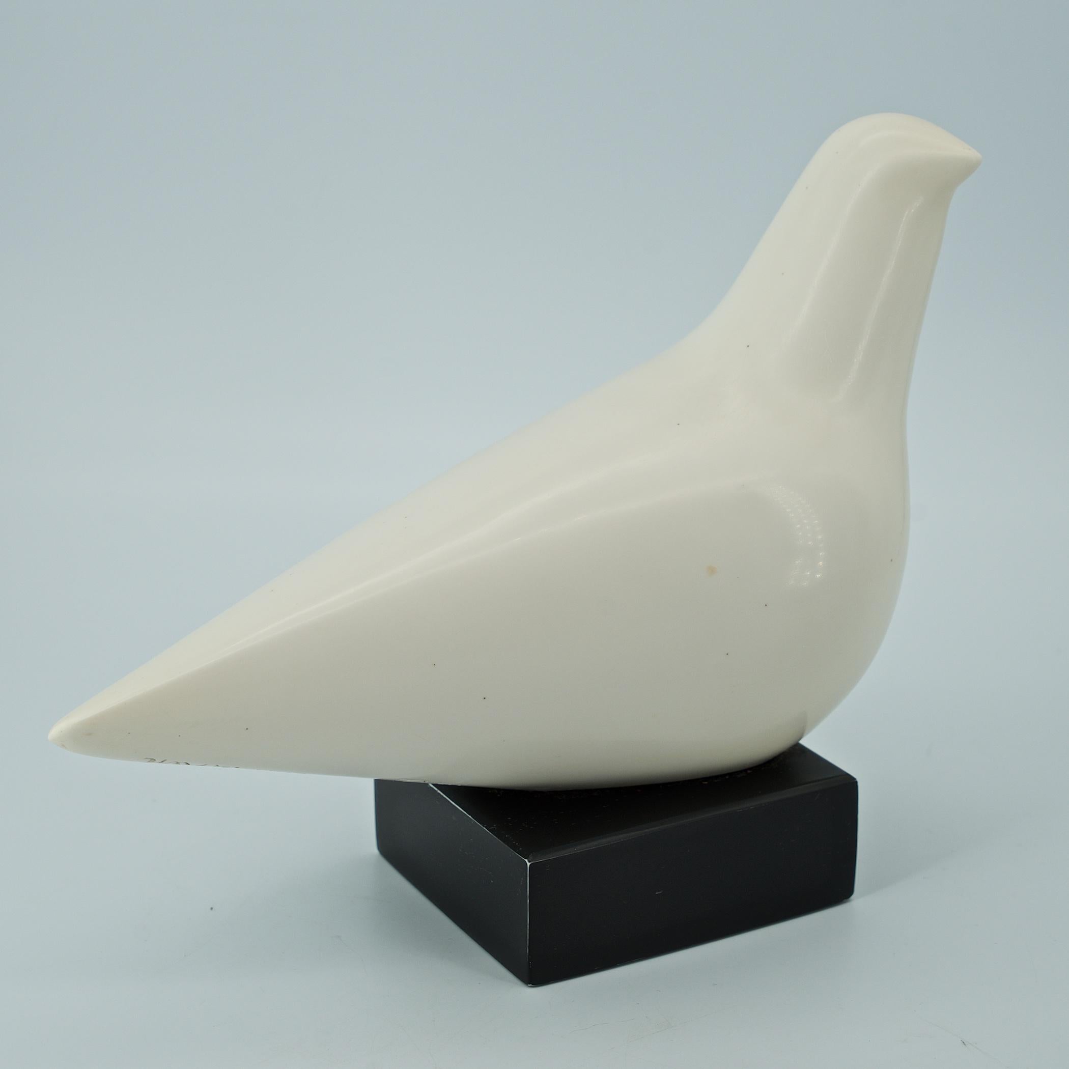 A very clean example of this now famous bird form sculpture by female artist Cleo Hartwig. This piece is 9 x 8, 5 lbs, and made of polished white marbelite/resin.

Signed in the mold, 