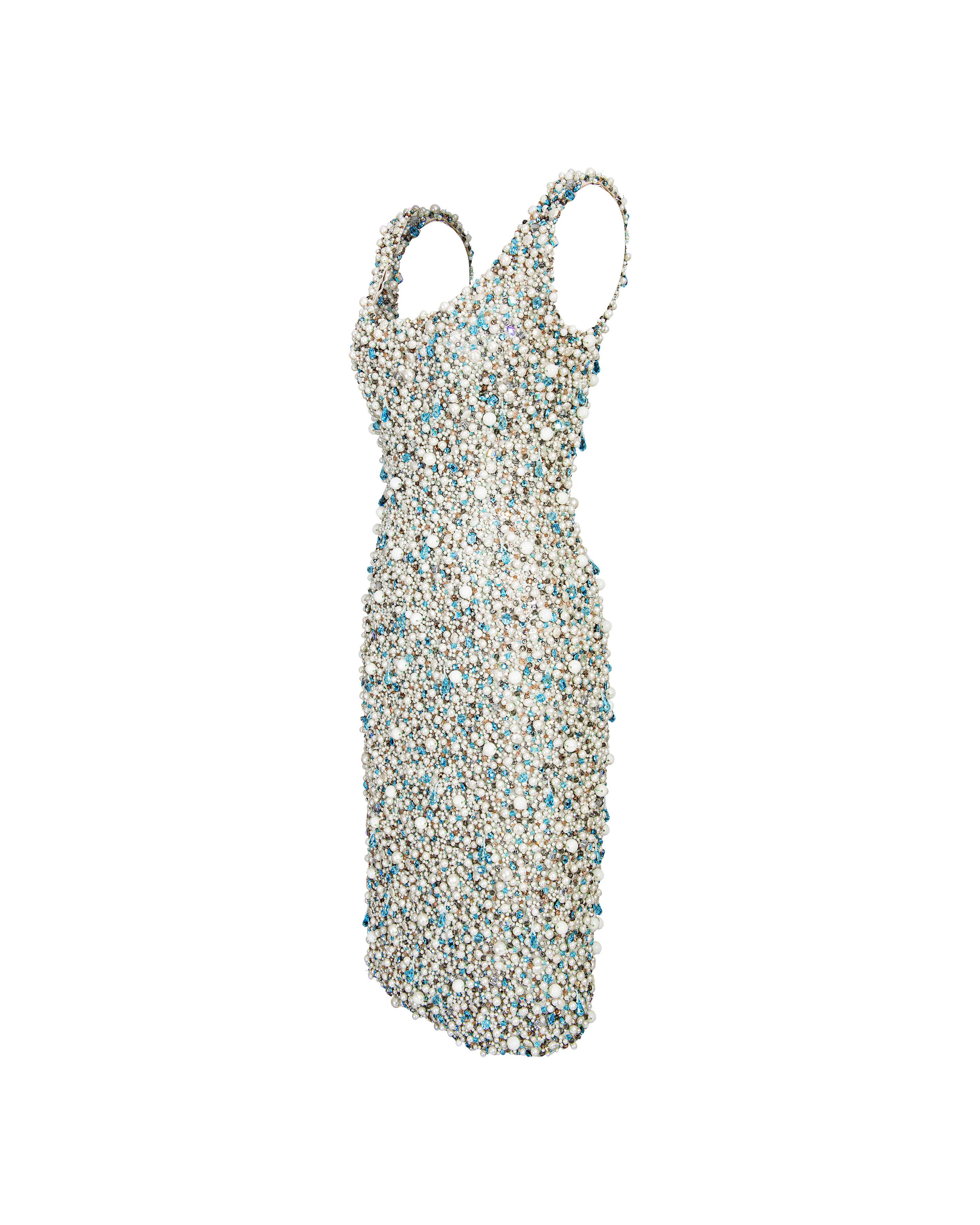 1960's faux pearl and blue gemstone fully hand-embellished couture Parisian runway sample above-knee dress. Sleeveless dress with very heavy embellishments throughout, including large faux pearls, blue gemstones and sequin detailing. Fully lined in