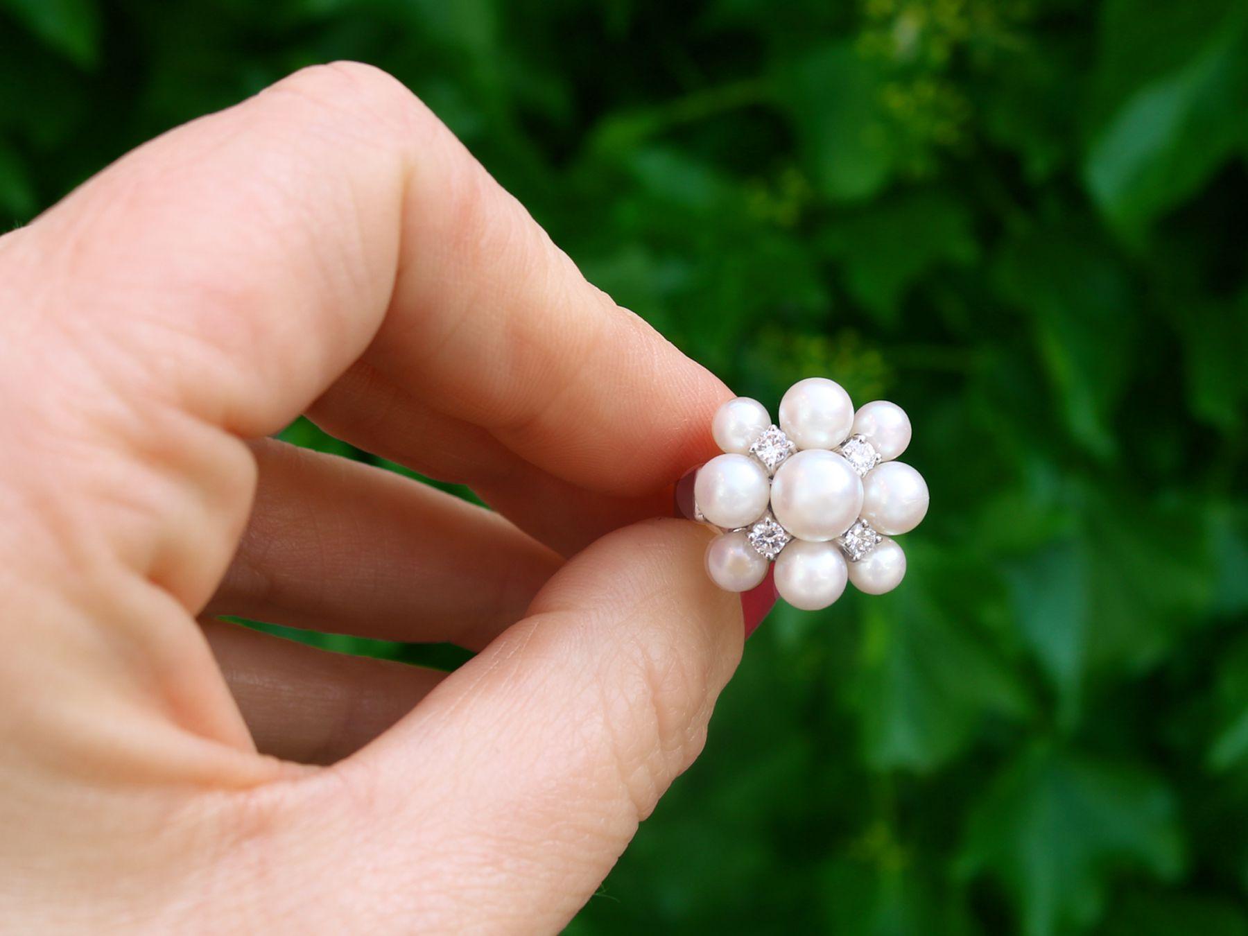 A stunning vintage 1960s cultured pearl and 0.31 carat diamond, 14 karat white gold cocktail ring; part of our diverse pearl jewelry and estate jewelry collections.

This stunning, fine and impressive vintage multi-pearl dress ring has been crafted