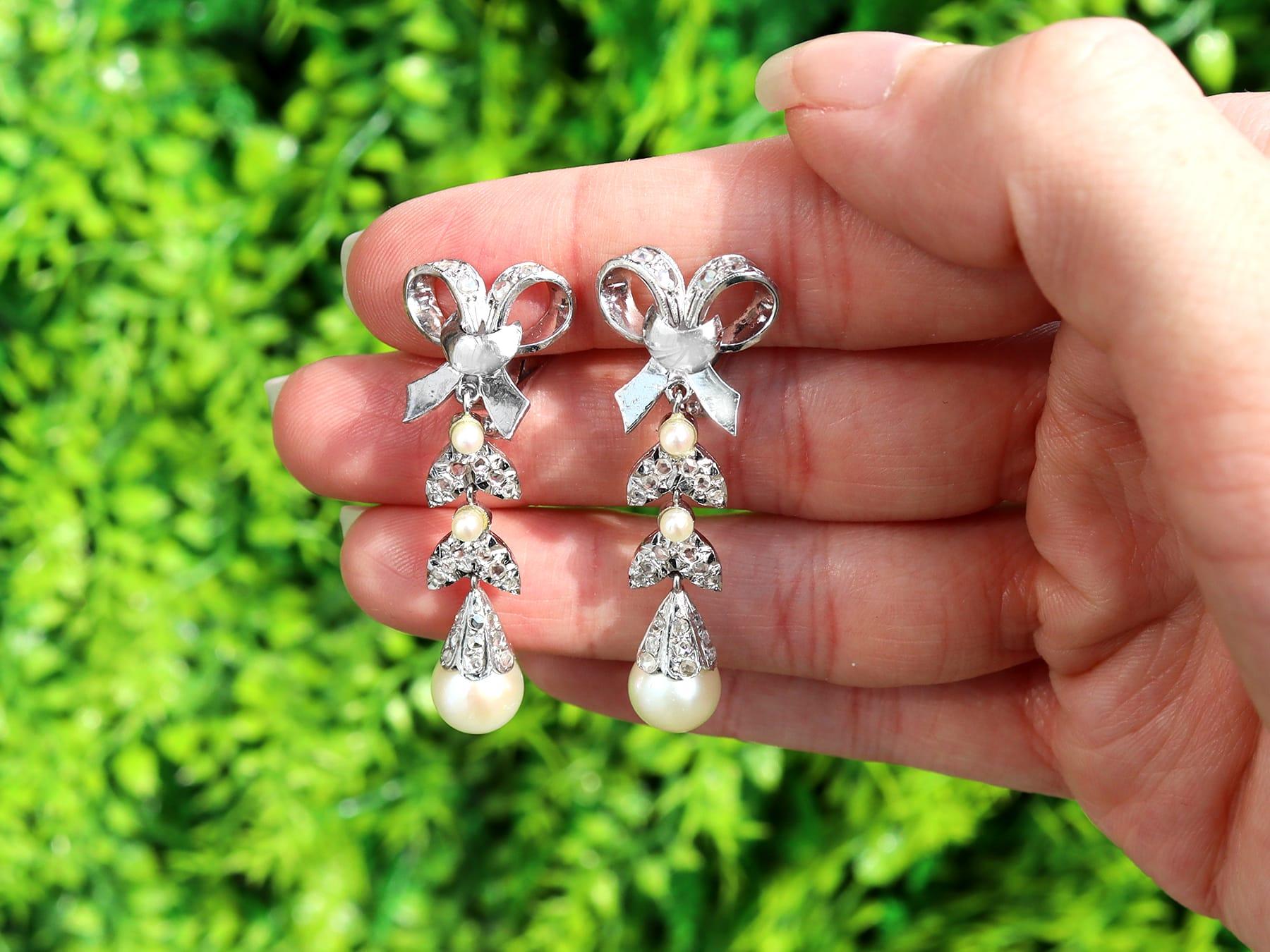 A fine and impressive pair of vintage 0.54 carat diamond and cultured pearl, 18 karat white gold clip on drop earrings; part of our diverse vintage jewelry and estate jewelry collections.

These fine and impressive pearl and diamond drop earrings