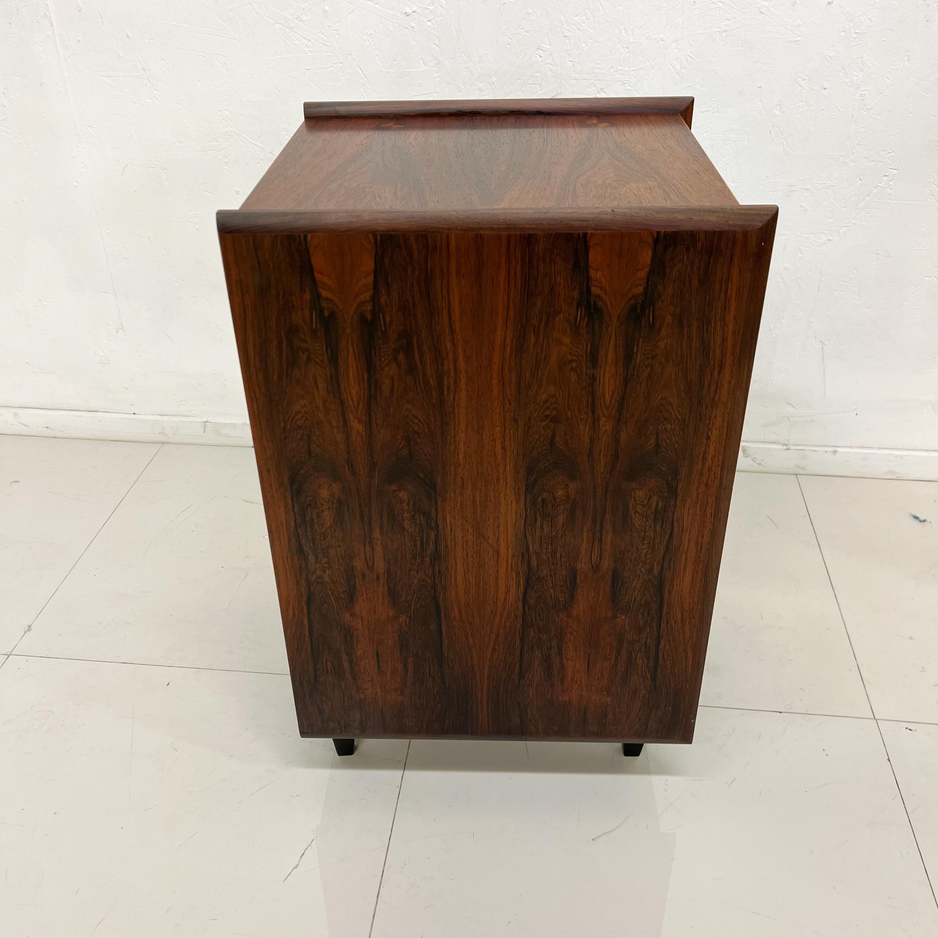 Side Table
Pega by Ib Juul Christensen of Norway circa 1960s
Unmarked
Elegant Rosewood Side Table with drawer
Functions as Cubby Cabinet Nightstand Bookcase
Versatile piece hooks allow attachment to wall unit.
Legs retrofitted for independent use as