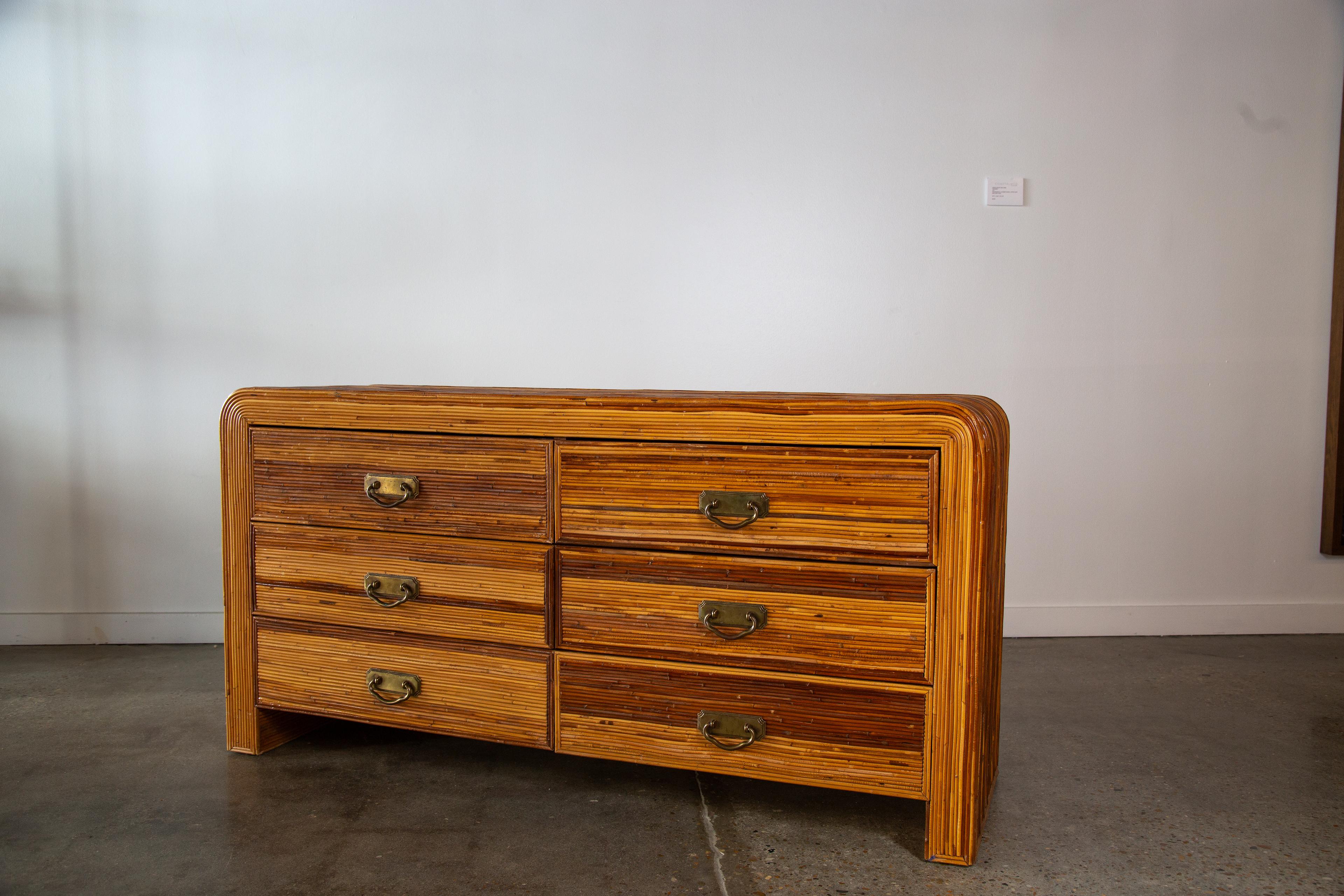 A beautiful 6 drawer dresser in split reed. The reed with different natural variations in color provides great movement and interest to a piece already enhanced with texture. 

Dimensions:60 5/8”W x 18 5/8” x 30 5/8”H

Condition:Good vintage