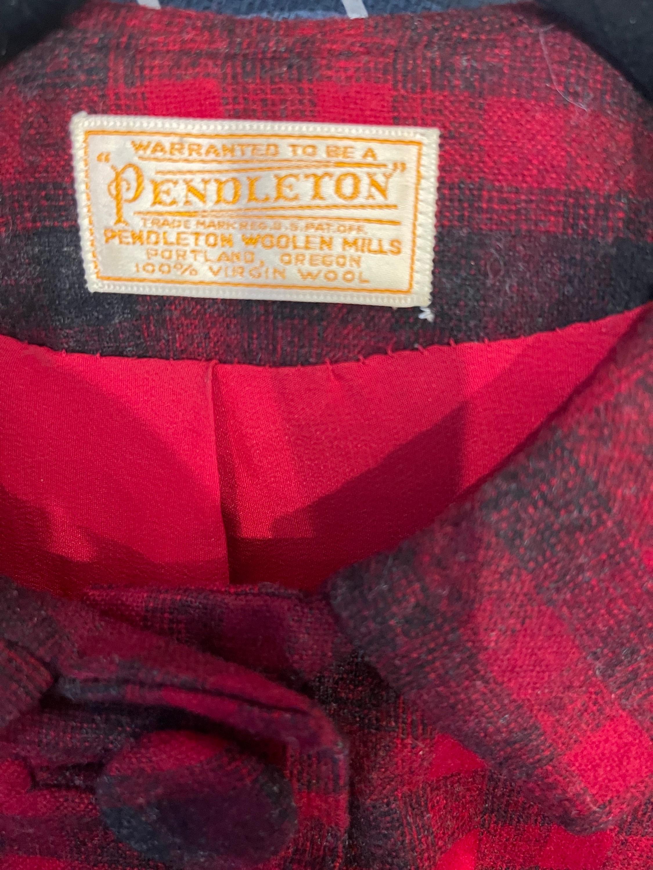 Chic early 60s Pendleton red and gray plaid 3/4 sleeves virgin wool jacket ! Features a tailored fit with fabric covered buttons up the front. 
Model in photos is US Size 6, and 5’8 feet tall
In great condition 
Made in USA
Approximately Size