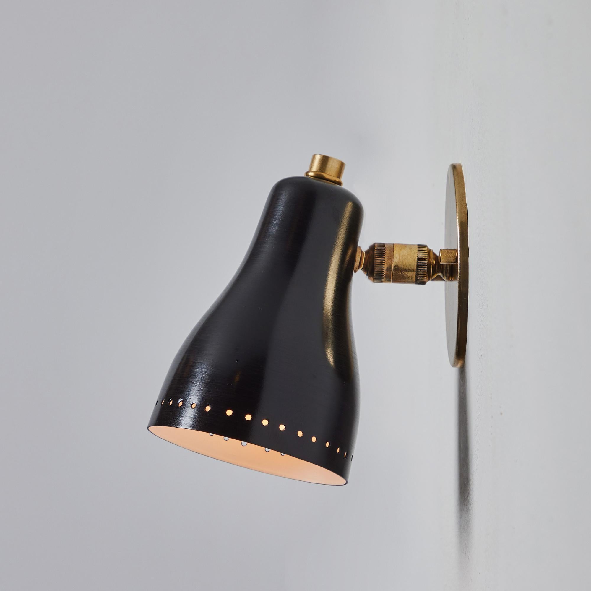 Painted 1960s Perforated Black and Brass Wall Lamp Attributed to Jacques Biny