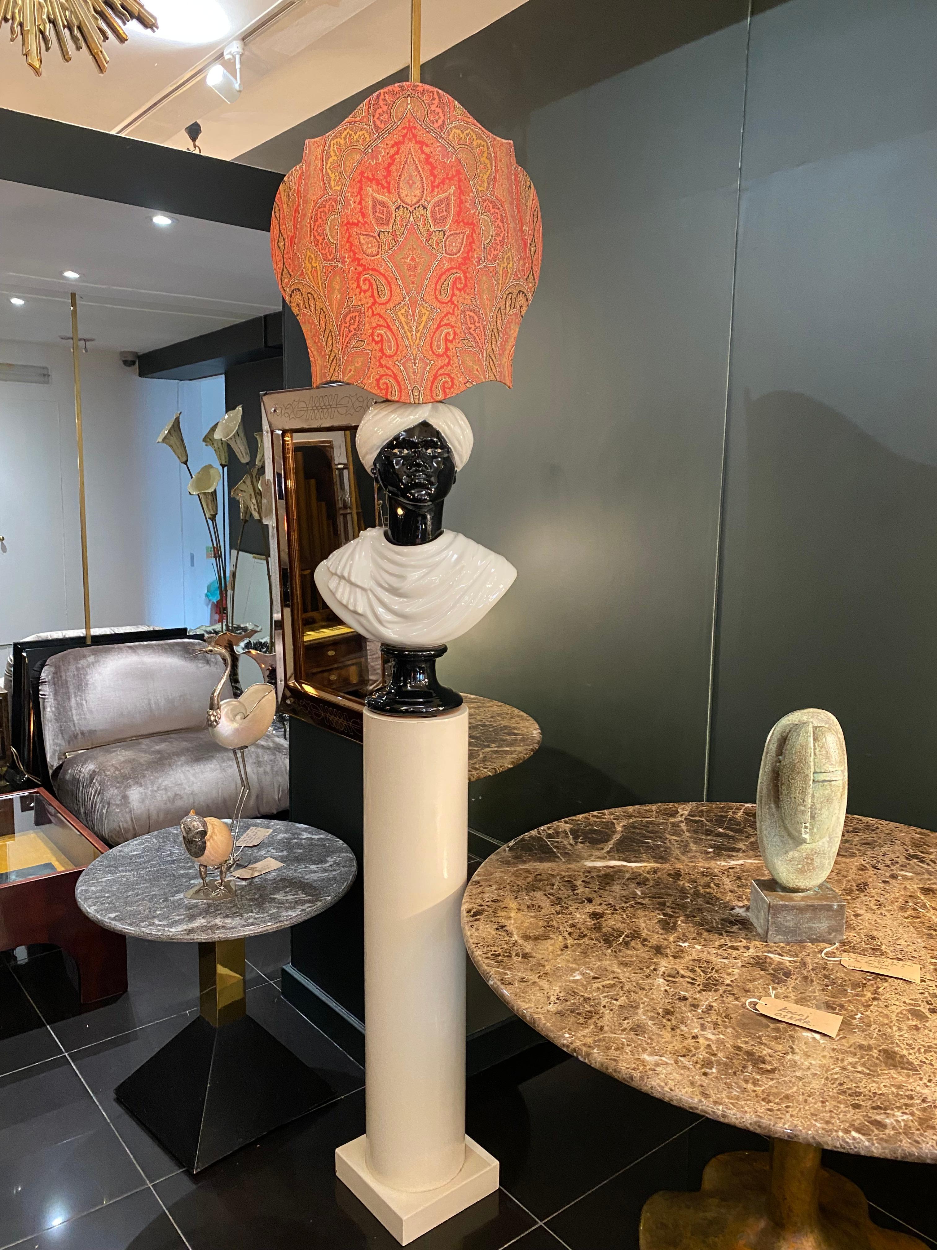 A rare Moor lamp by Piero Fornasetti c.1960 Milan, Italy. Enamelled cream metal column with a black and white glazed ceramic Blackamoor bust and an original elaborate paisley shade. An absolutely fabulous statement piece signed: Fornasetti Made in