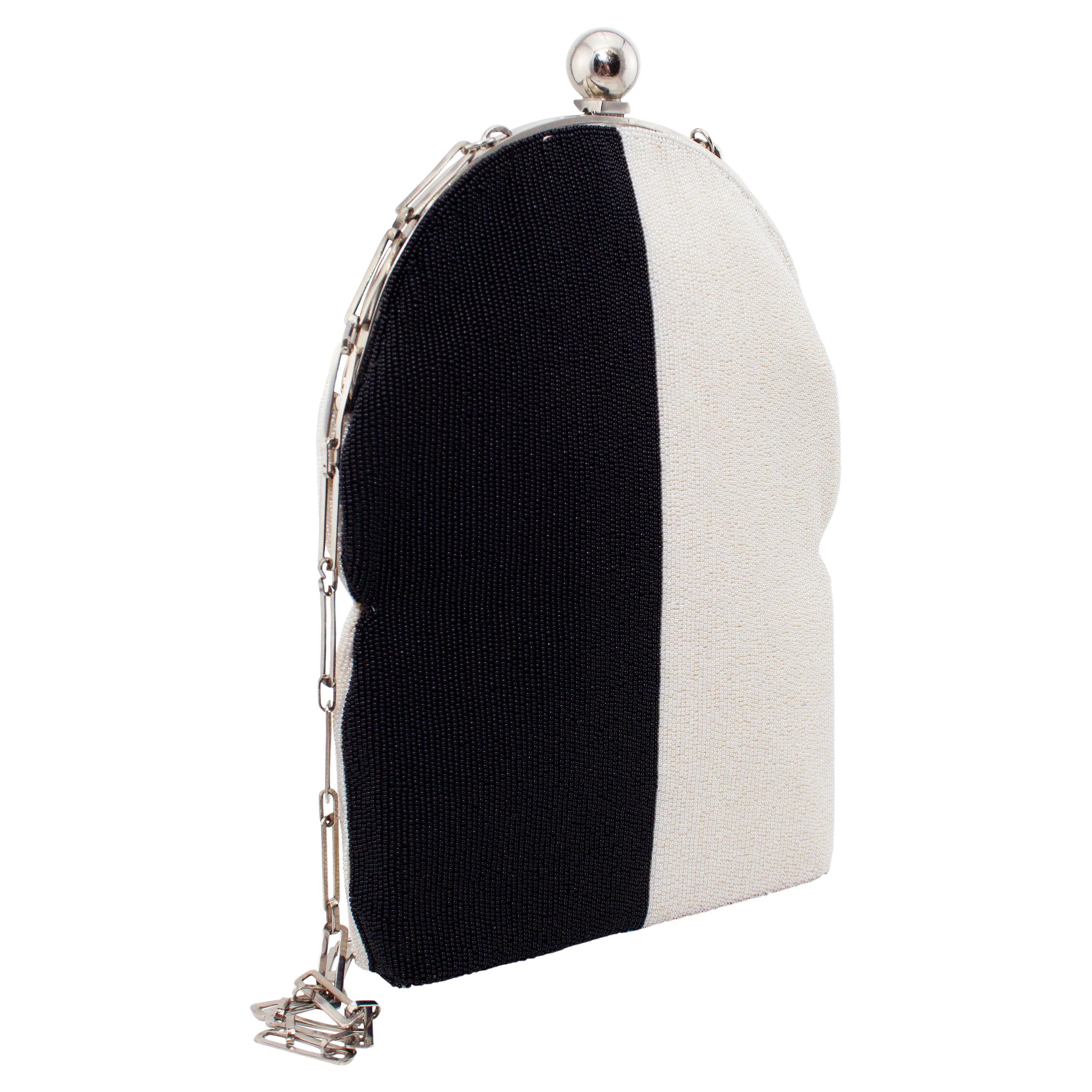 1960's Pierre Cardin mod, op art style black and white seed beaded evening bag with oblong chain link strap that can be tucked inside the hard frame clasp or worn lady-bag style. Both sides have identical beading and the interior is lined in off