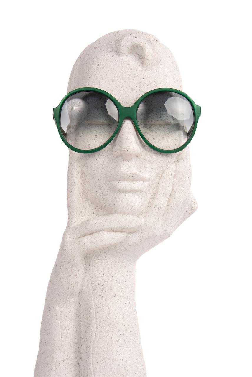 These show-stopping 1960s vintage Pierre Cardin model 204-40 sunglasses feature a round oversized opaque British racing green frame. The original plastic lenses are tinted in gradient grey (non prescription).

The colour and the shape of these