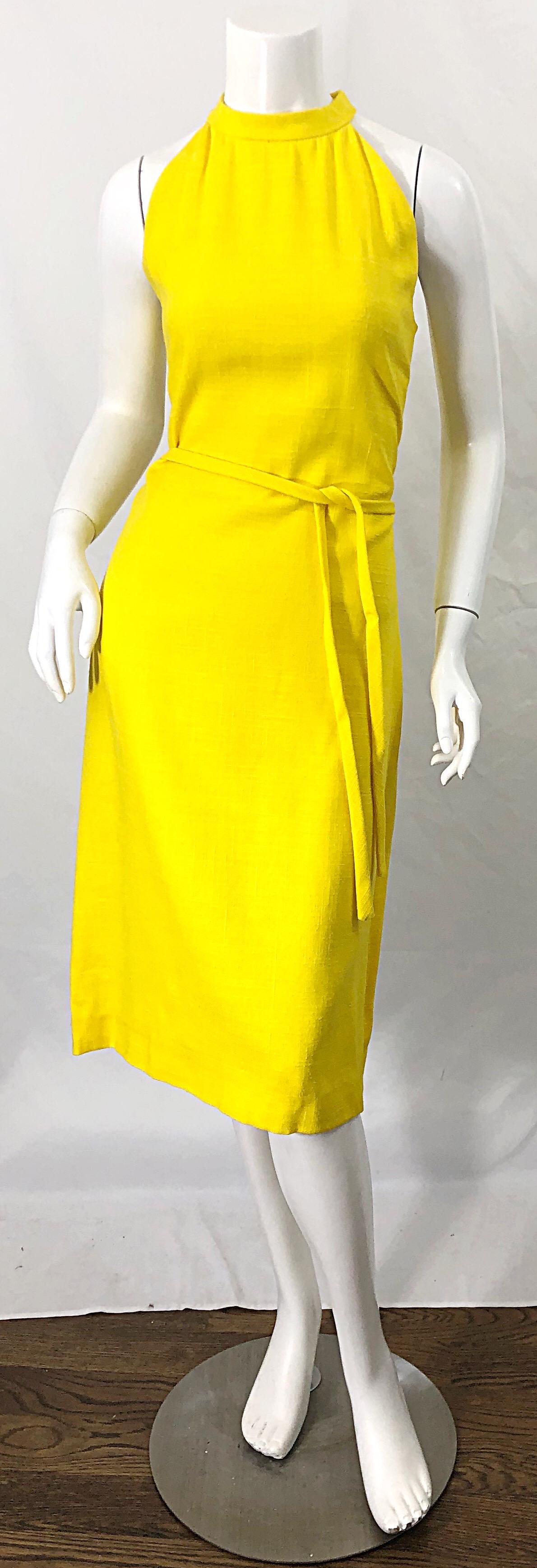 Chic PIERRE CARDIN late 60s canary yellow linen sleeveless dress ! Features a flattering neckline with intricate pleating details. Hidden zipper up the back with hook-and-eye closure. Detachable tie belt in the same fabric. Fully lined. A true