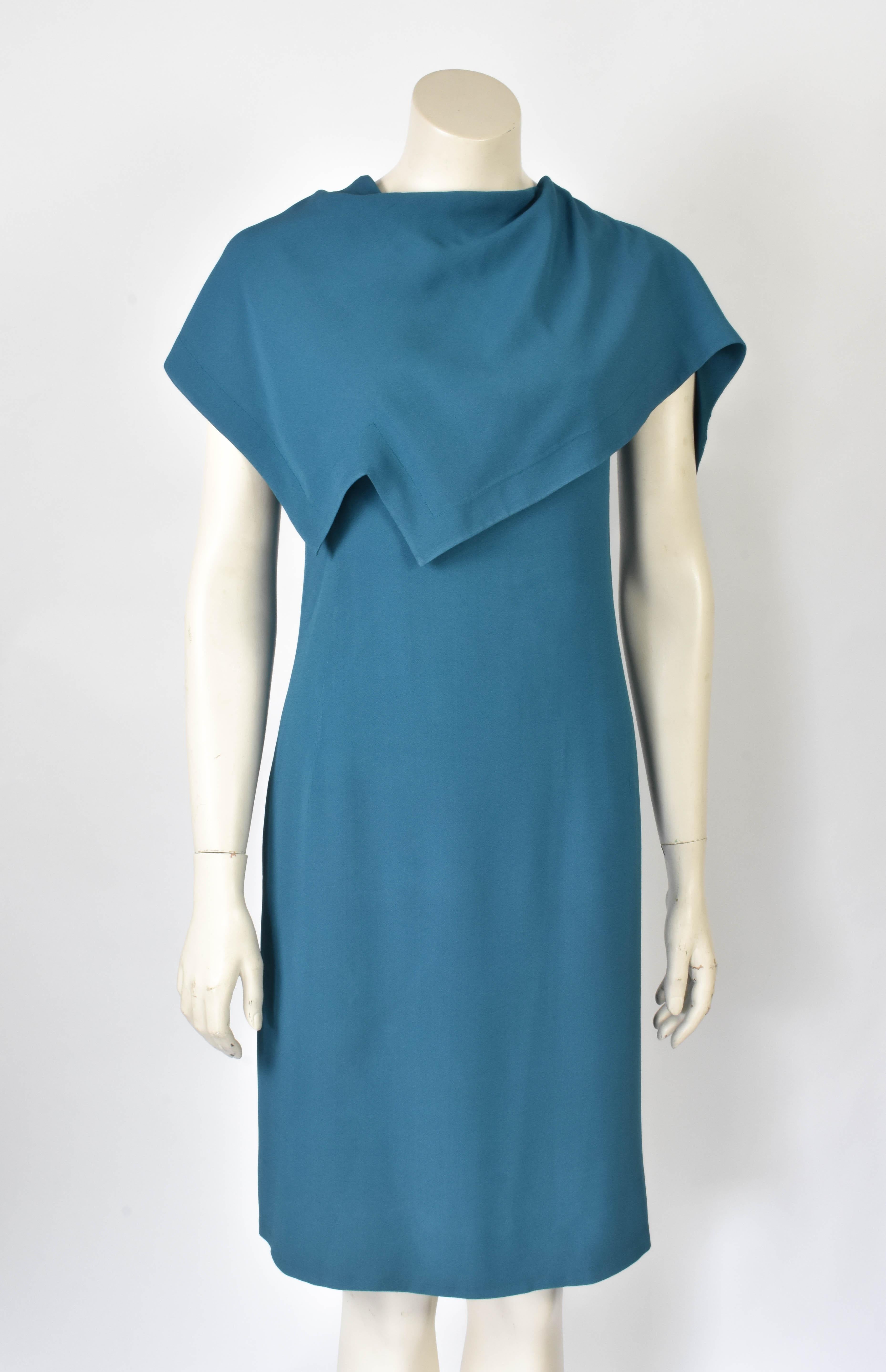 A Haute Couture dress by Pierre Cardin in a fantastic shade of blue. This space age dress is late 1960s and has an attached assymetrical cape.