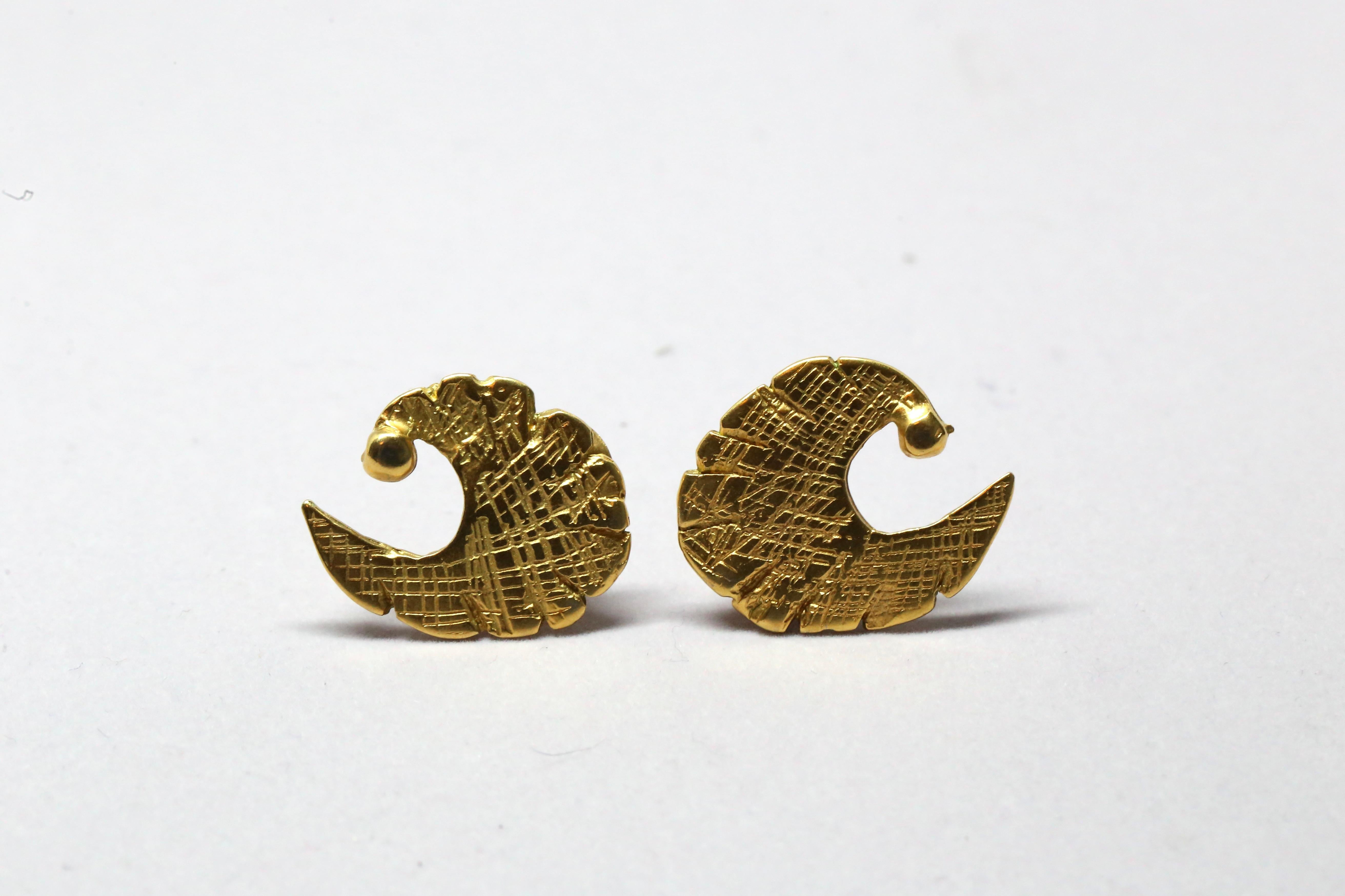 Abstract shaped gilt earrings done in the shape of a 'C' from Pierre Cardin dating to the 1960's. Clip backs. Earrings measures approximately 1.25