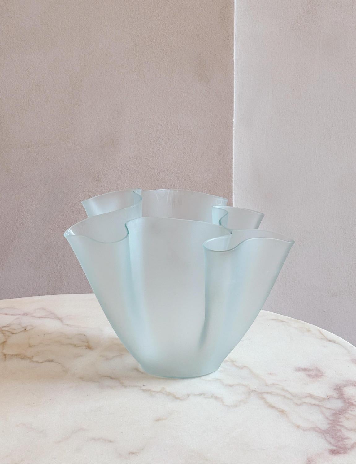 A wonderful pale blue frosted glass 1960s 'Tissue Vase' by the great mid-century Italian designer, Pietro Chiesa. The glass is wonderfully folded to create the iconic 'cartoccio' vase. We have two of these vases which can be sold individually or as