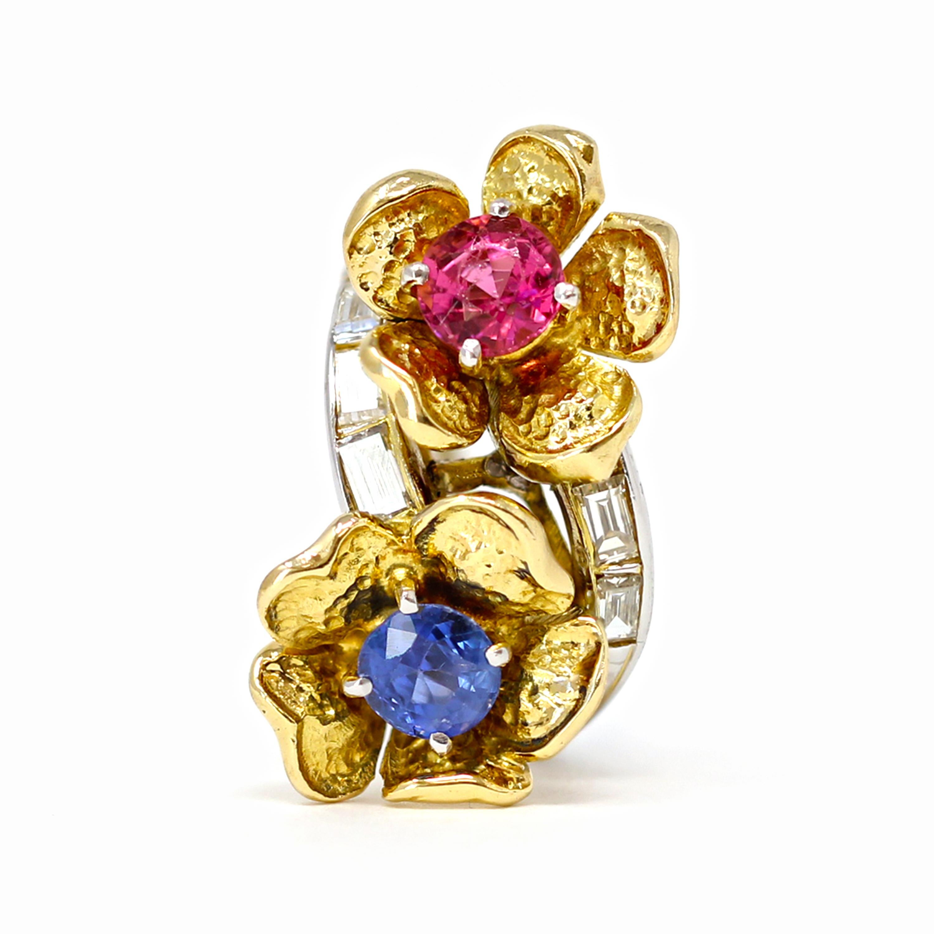 A blue and pink sapphire bypass two tone ring circa 1960. The bypass ring features a well matched old cut blue and pink natural sapphires of approximately half a carat each, delicately nestled in an 18k yellow gold flower fashion design. The