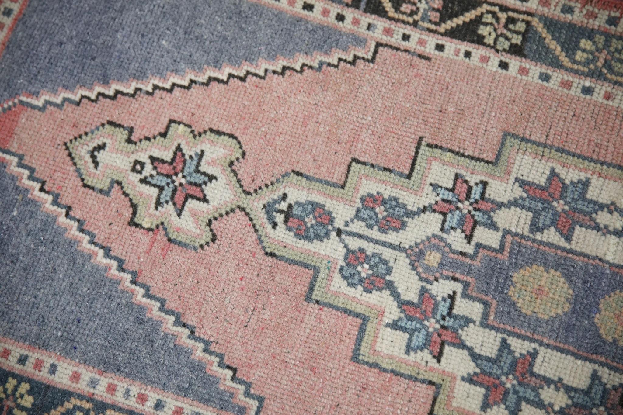 Introducing our exquisite vintage mini Turkish rug, expertly crafted by skilled artisans using traditional techniques that have been perfected over centuries. Made entirely from 100% handwoven wool, this rug boasts a soft and durable texture that