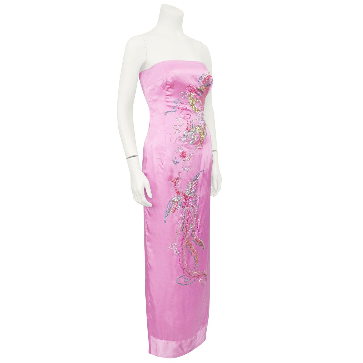 Very beautiful pink silk satin strapless gown from the 1960s. A custom copy of an original from the 1940's. Hand embellished with Chinoiserie sequin and beaded dragon and phoenix across the front. Fitted through the body. Tea length column skirt