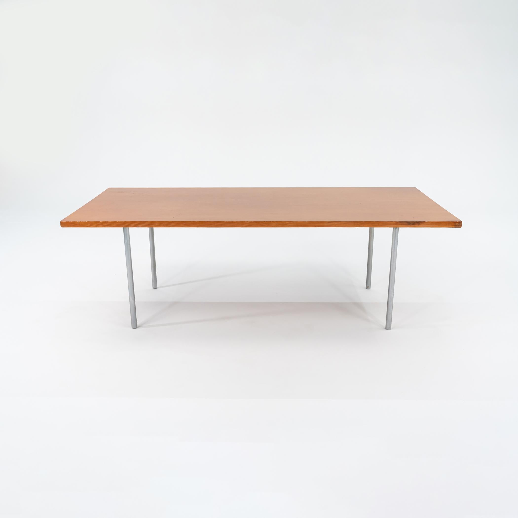 This is a PK-41 Rectangular Dining Table, designed by Poul Kjaerholm for E. Kold Christensen in 1964. This table dates to the 1960s. It features a top made of Oregon Pine and has four chromed steel legs. This minimalist table is an important icon of